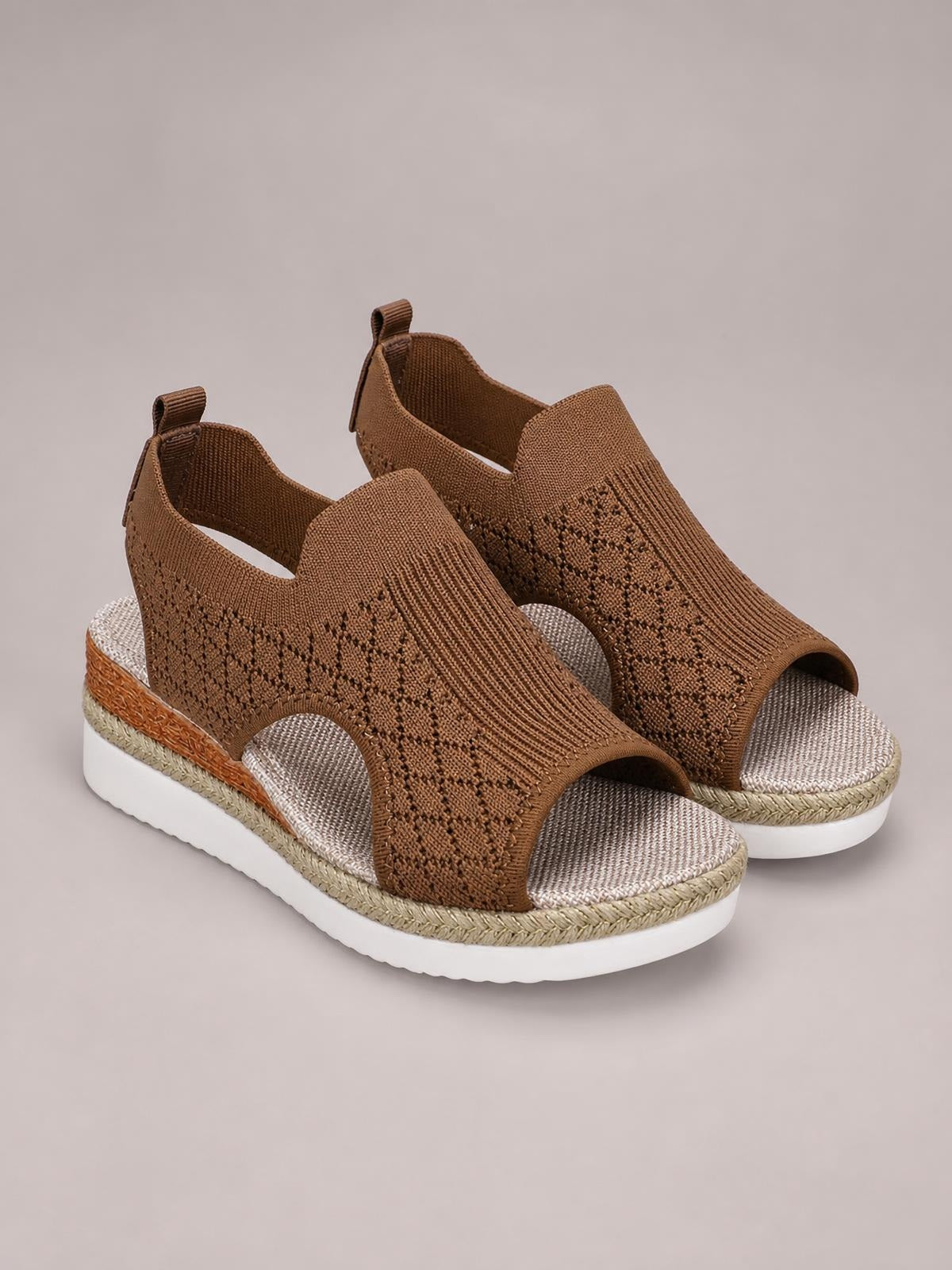 Brown mesh open toe platform wedge sandals feature a textured woven upper, mid-height wedge heel, cushioned footbed, and white rubber sole.