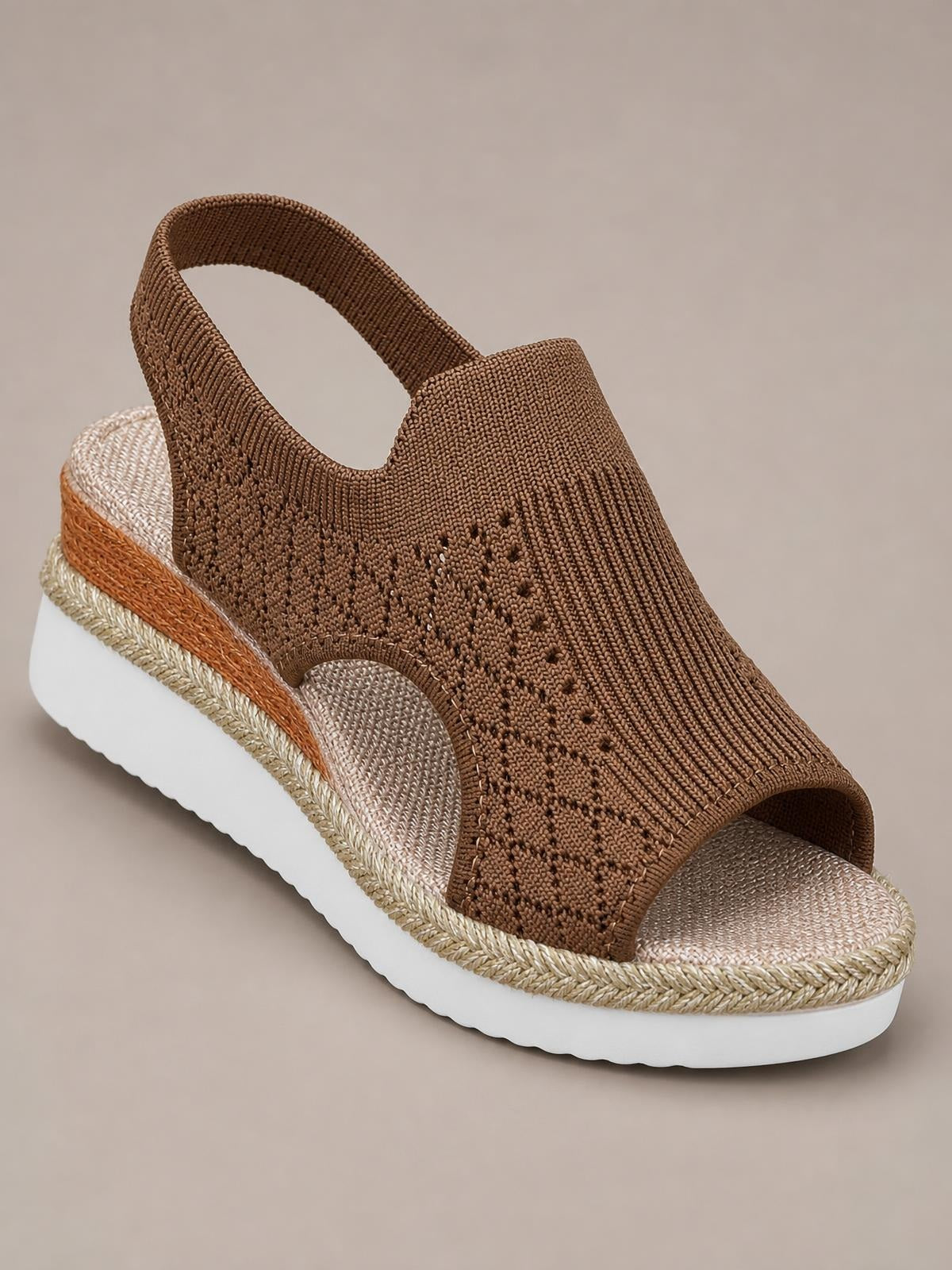 A brown mesh open toe platform wedge sandal features a slingback strap, textured woven upper, braided midsole, and white rubber sole.