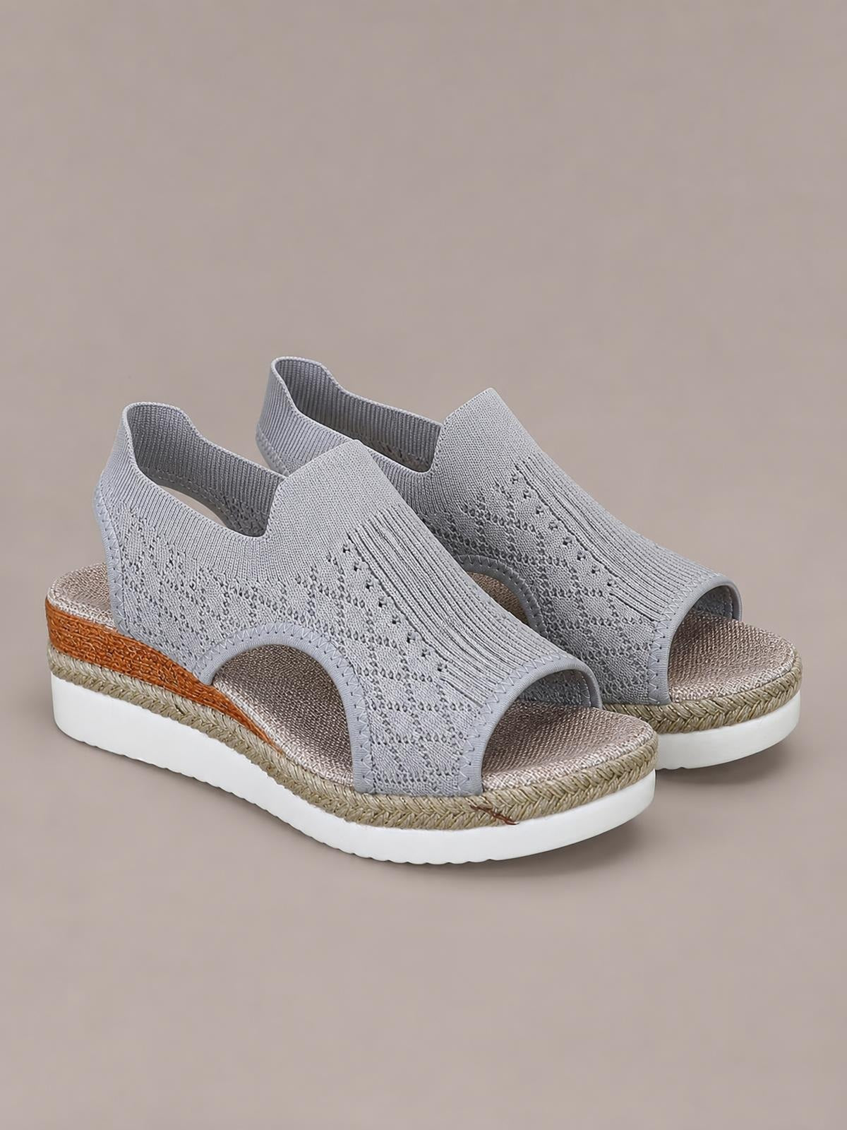 Gray mesh and PU leather open toe platform wedge sandals with mid-height heels, decorative side cutouts, and textured espadrille-style trim.