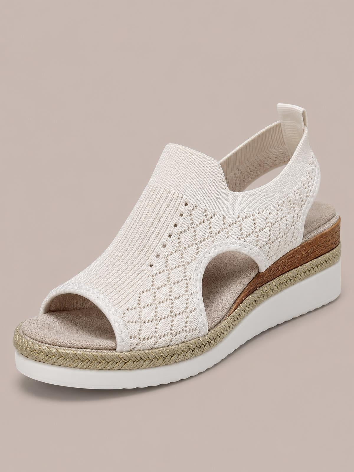 White mesh open toe platform wedge sandal with a textured upper, side cutout, mid-height wedge, braided trim, and chunky rubber sole.