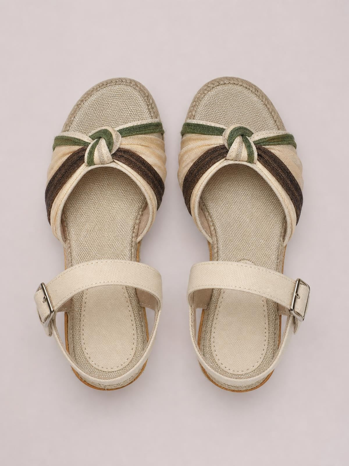 Beige open toe platform wedge sandals feature woven cream, green, and brown straps, cushioned footbeds, and adjustable ankle buckles.