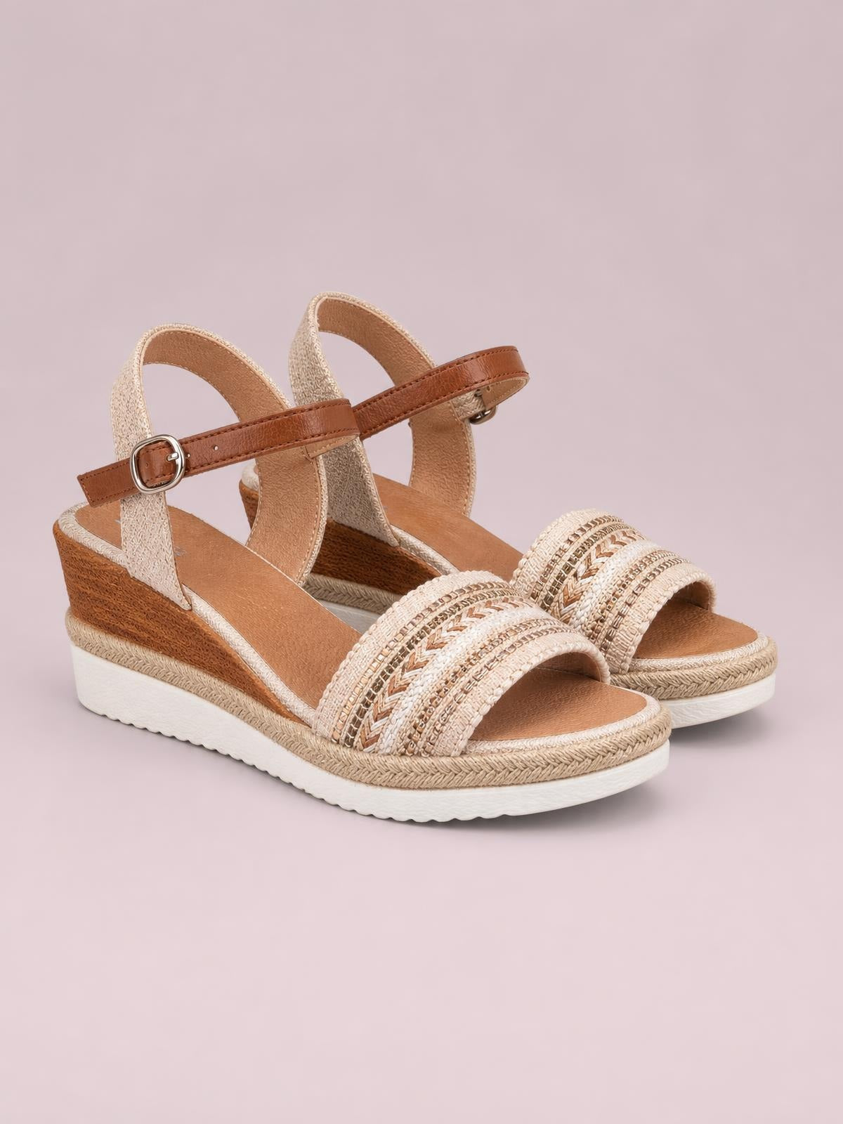 Open toe platform wedge sandals in tan and cream feature woven front straps, adjustable buckled ankle straps, and a mid-height espadrille-style wedge sole.