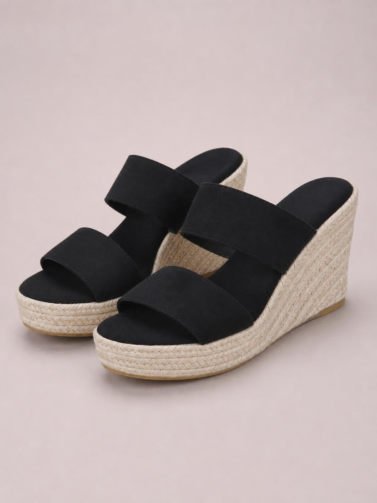 Black open-toe platform wedge sandals with wide suede straps, mid-height woven espadrille-style wedge heels, and textured elastomer soles.