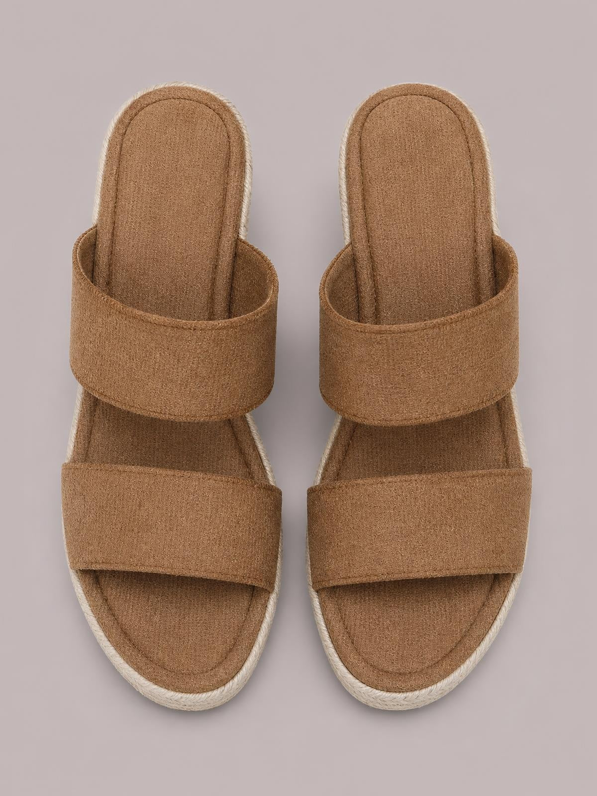 Tan suede open toe platform wedge sandals feature two wide crossover straps, cushioned footbeds, and textured rope-trimmed soles.
