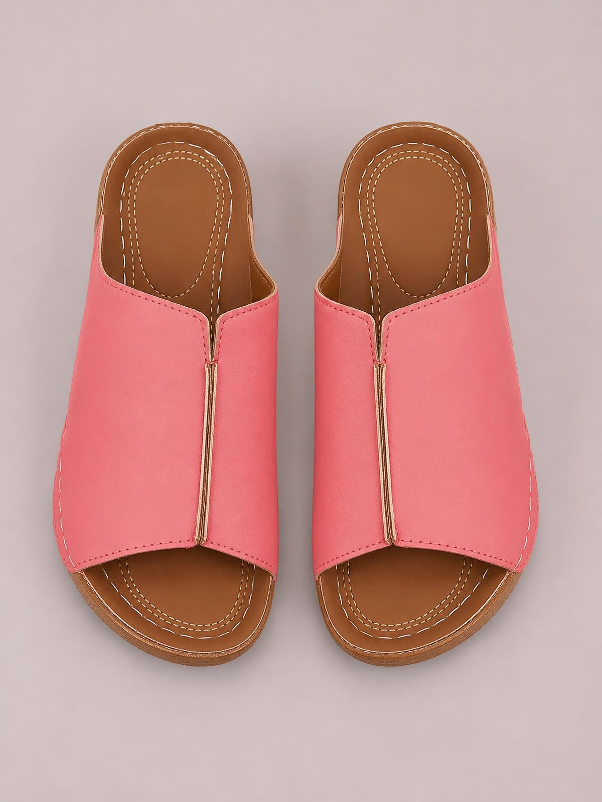 Pink open-toe wedge sandals feature smooth PU uppers, a center seam, brown contrast footbeds, and low textured wedge soles with stitched detailing.