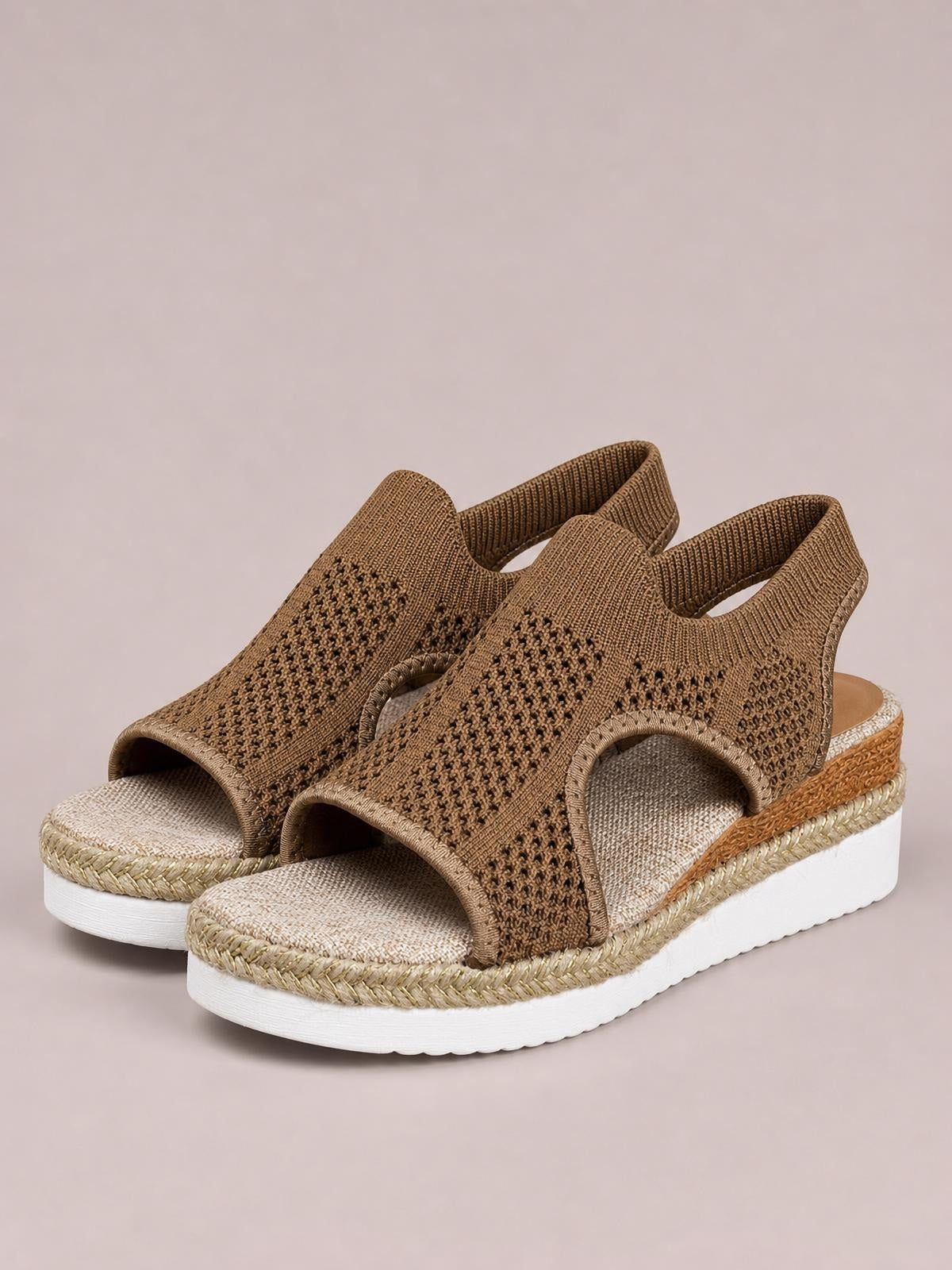 Brown open toe woven wedge sandals feature wide breathable straps, open sides, textured footbeds, and thick white mid-height soles with braided trim.