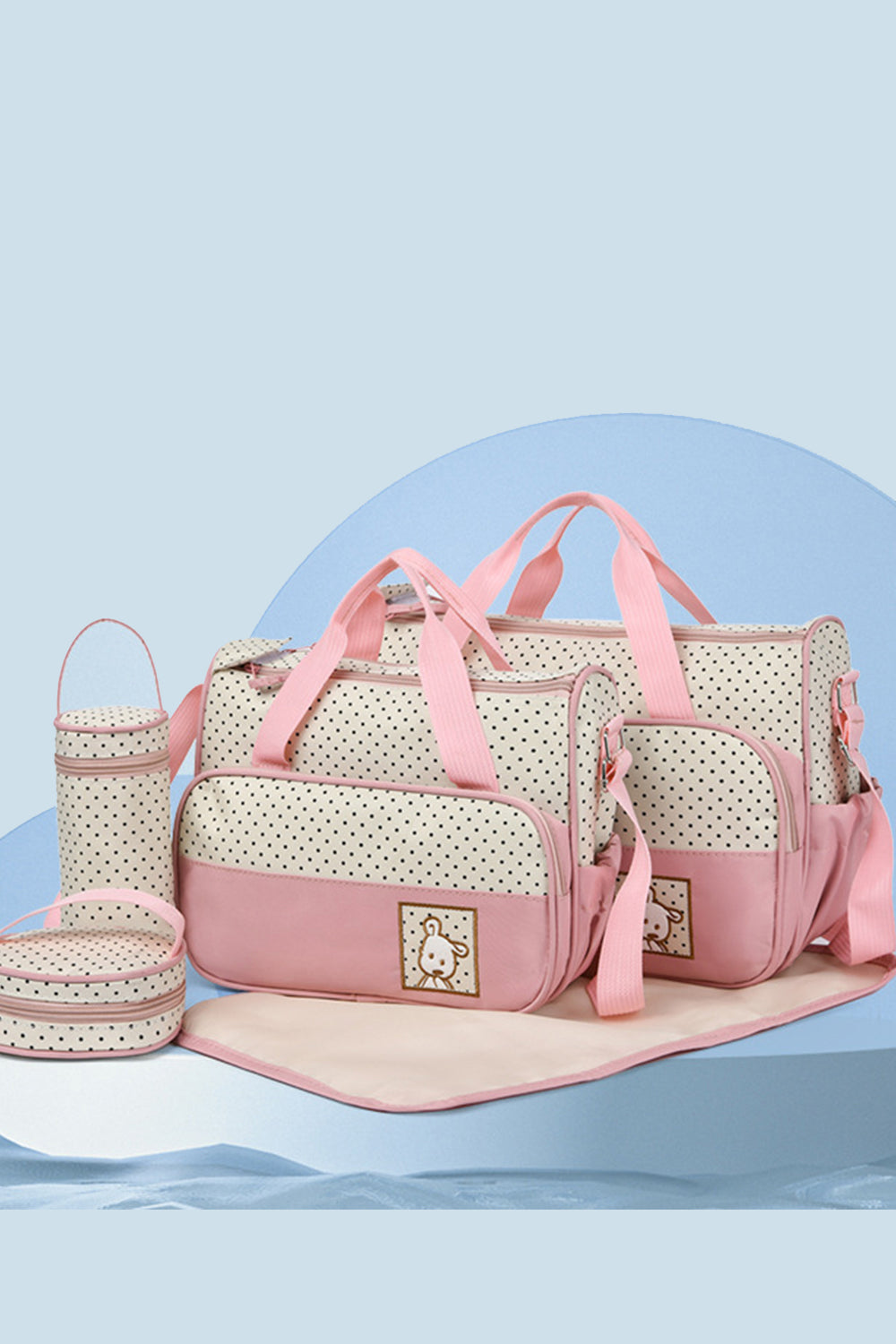 Pink and cream Oxford cloth 4-piece bag set with polka-dot contrast panels, structured tote, smaller bags, bottle carrier, meal bag, and diaper pad.