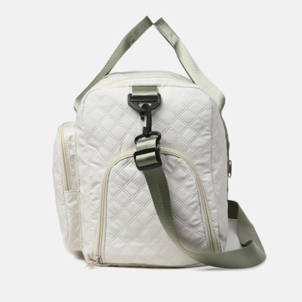 An oversize white Oxford cloth travel bag with a quilted duffel silhouette, sturdy top handles, adjustable shoulder strap, and multiple zip pockets.