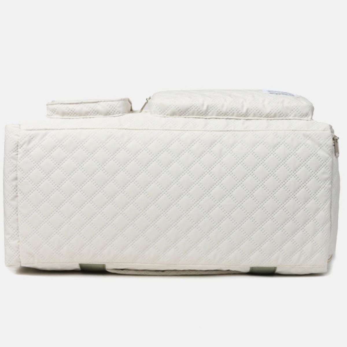 Oversize white Oxford cloth travel bag with a quilted finish, roomy duffel silhouette, zip-top opening, exterior compartments, and a broad sturdy base.