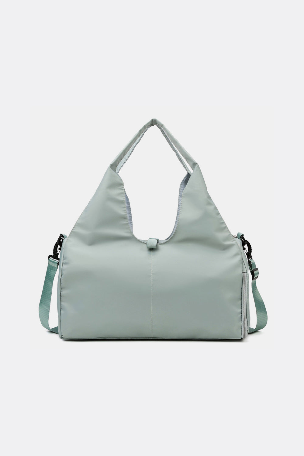 Large pale sage Oxford cloth waterproof travel bag with a broad soft-structured silhouette, dual top handles, long shoulder strap, and side zip details.