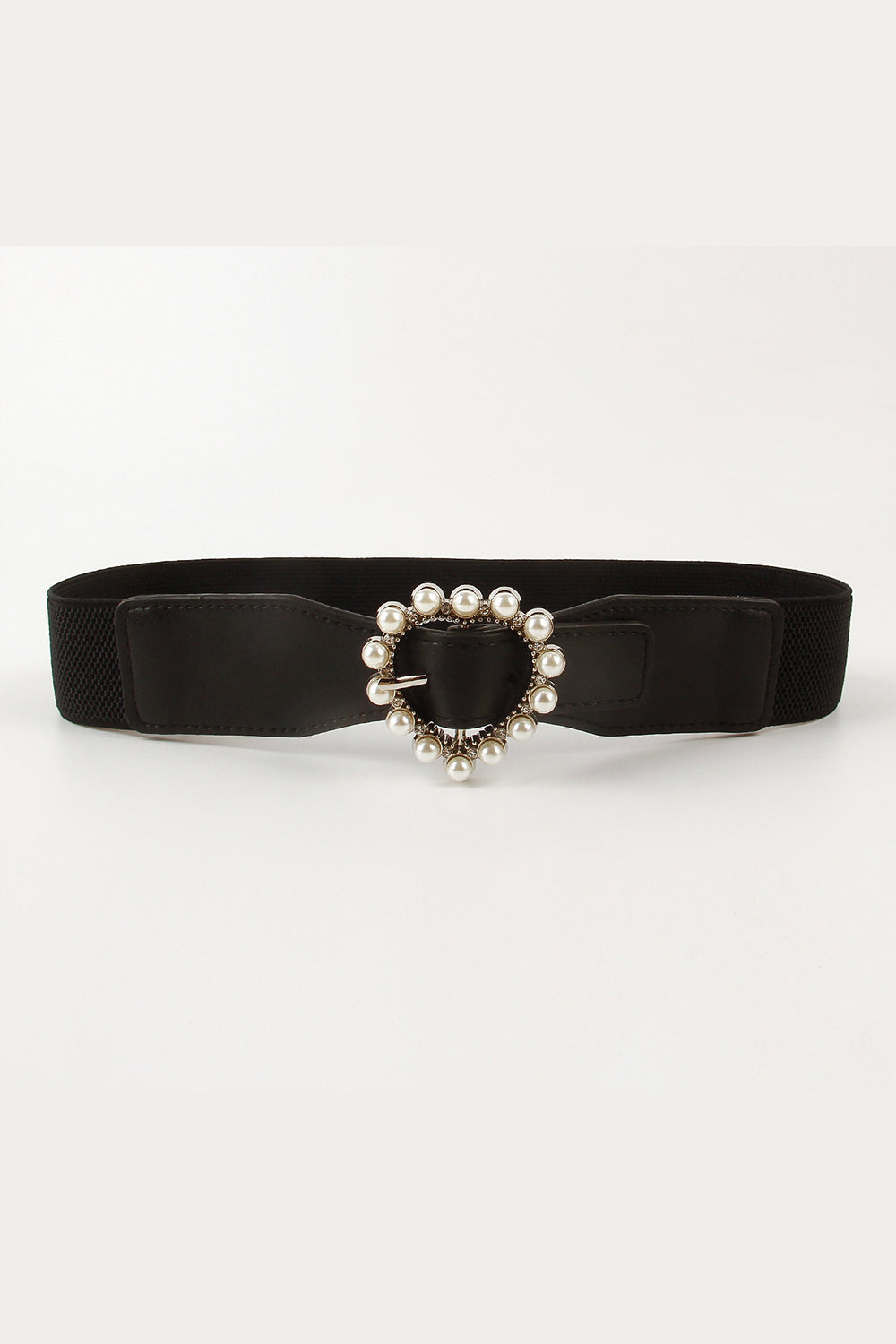 Black elastic belt with PU detailing and a statement heart-shaped buckle framed by pearl-like accents, shown flat with a softly structured silhouette.