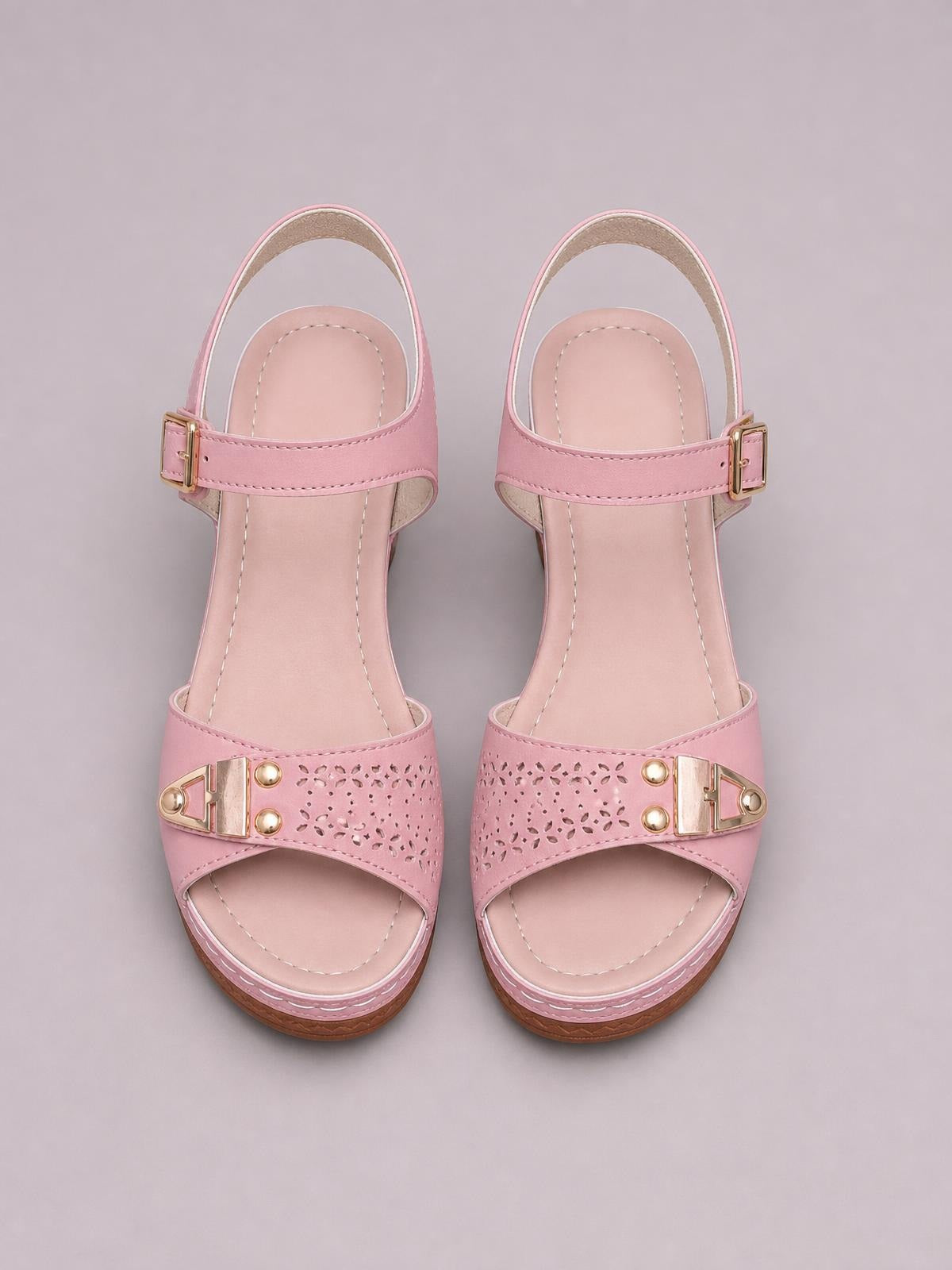 Pink peep toe block heel sandals with ankle buckles, perforated front straps, gold-tone hardware, stitched insoles, and mid-height platform soles.