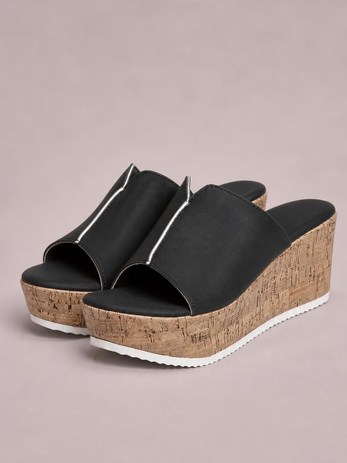 Black peep toe high heel sandals feature wide PU uppers with silver trim, cushioned footbeds, cork-textured wedge platforms, and white rubber soles.