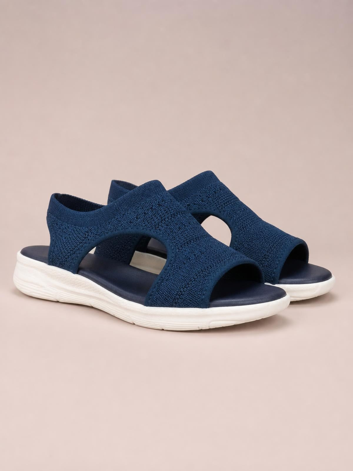 Navy blue solid-color peep-toe sandals feature textured wide straps, open sides, cushioned footbeds, and flat white rubber soles for a sporty silhouette.