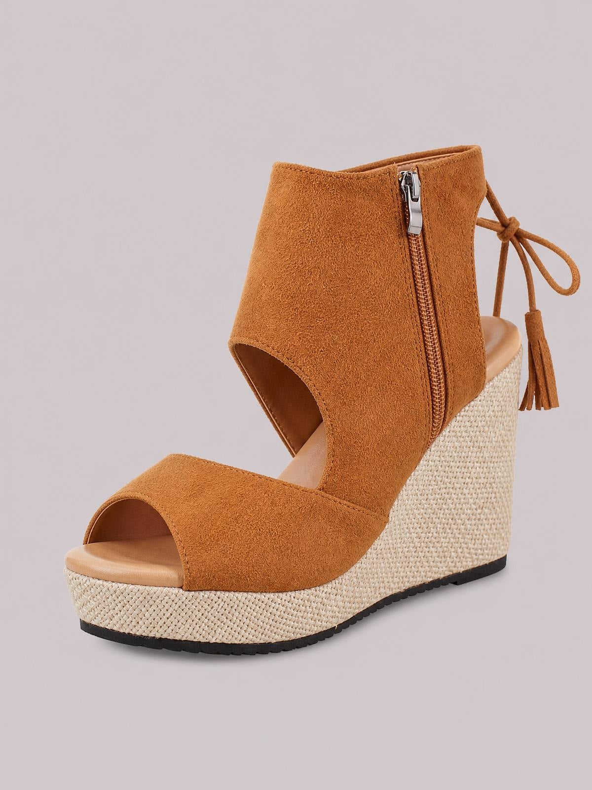 Tan suede peep toe wedge sandals feature broad straps, ankle-high sides with a side zipper and tie tassels, plus a woven espadrille mid heel and rubber sole.
