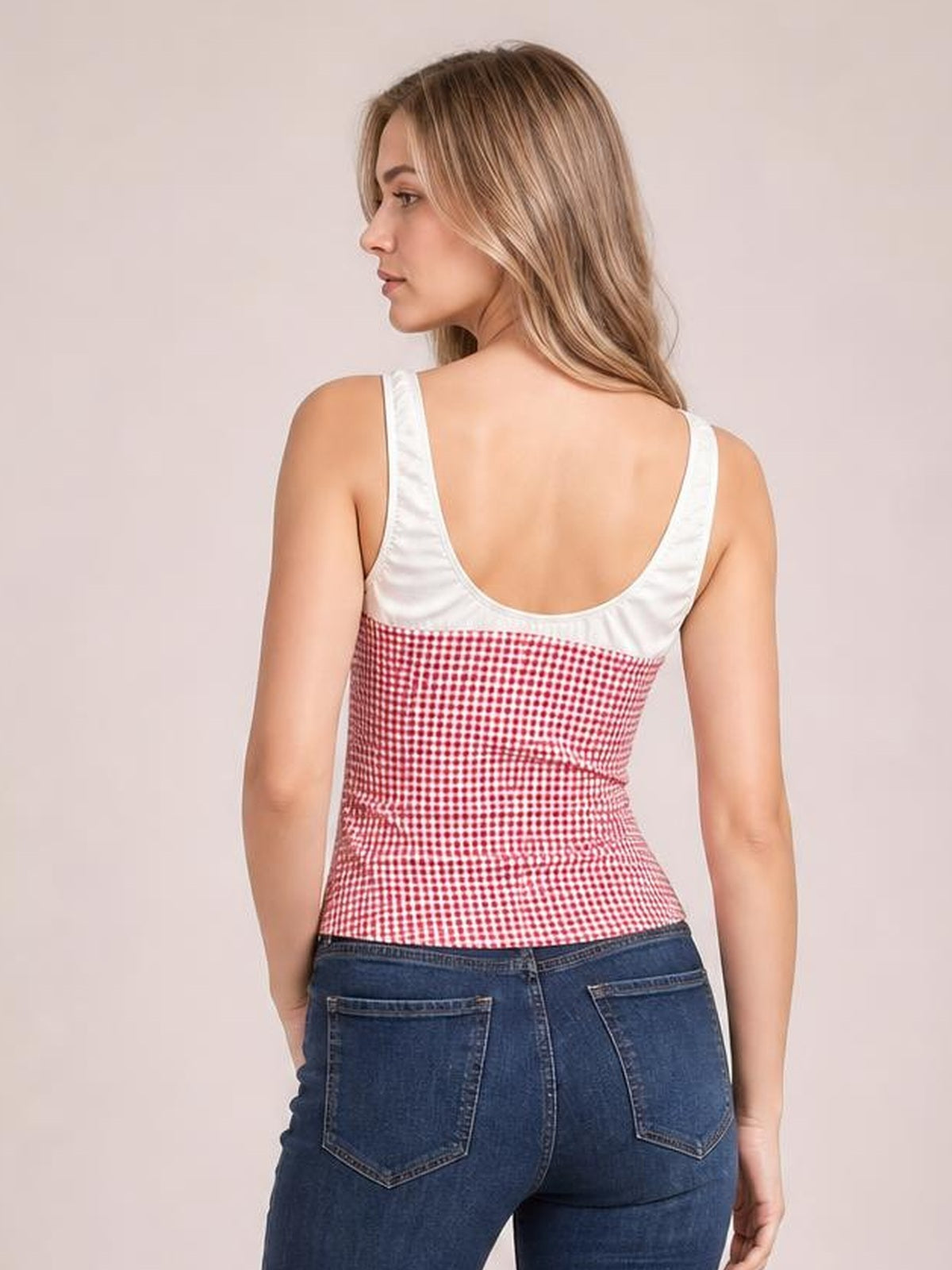 Model shown from the back in a fitted contrast plaid tank with white trim, wide shoulder straps, a low scoop back, and contoured seaming.