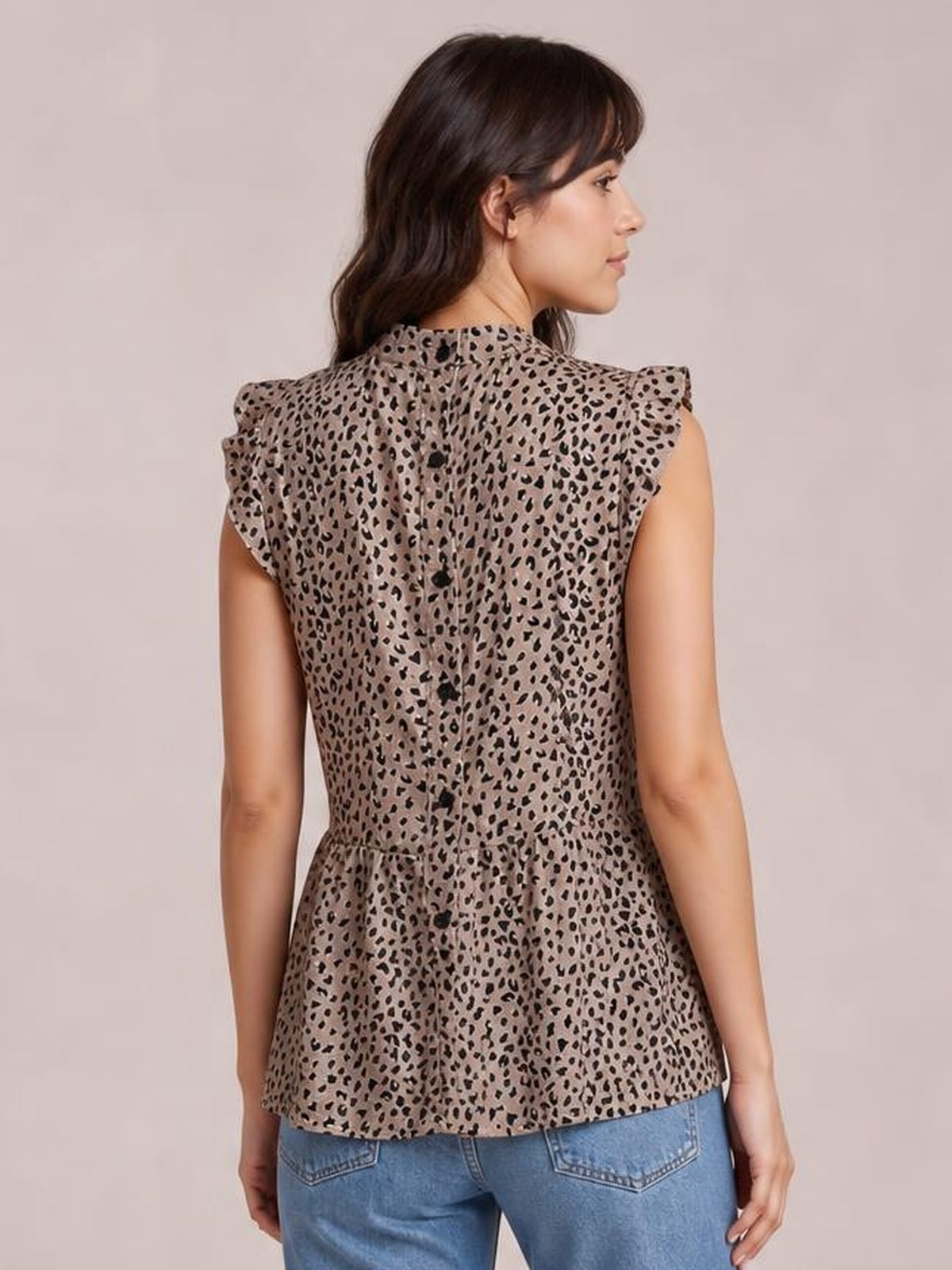 Model shown from the back wearing a taupe leopard-print blouse with a mock neck, ruffled cap sleeves, buttoned back, and softly flared peplum silhouette.