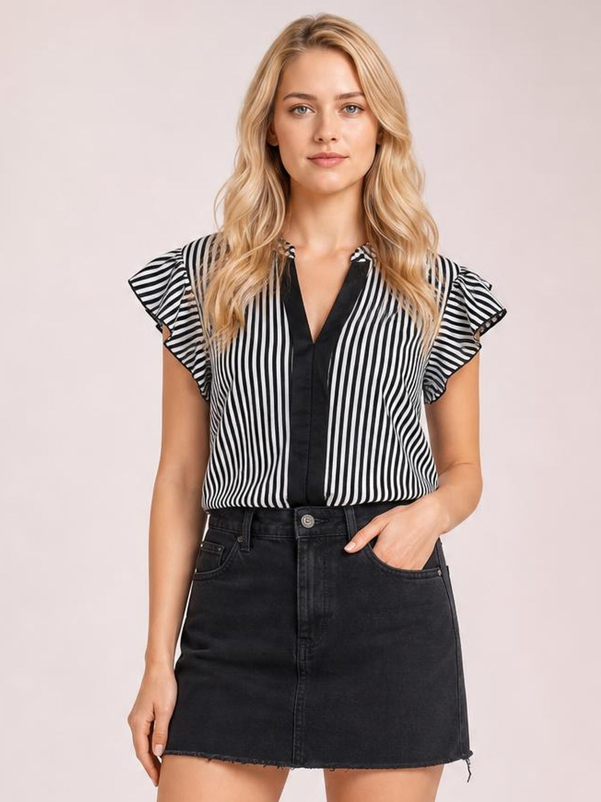 Model wearing a black-and-white striped blouse with ruffled cap sleeves, a notched V-neck, button-front construction, and a relaxed straight silhouette.