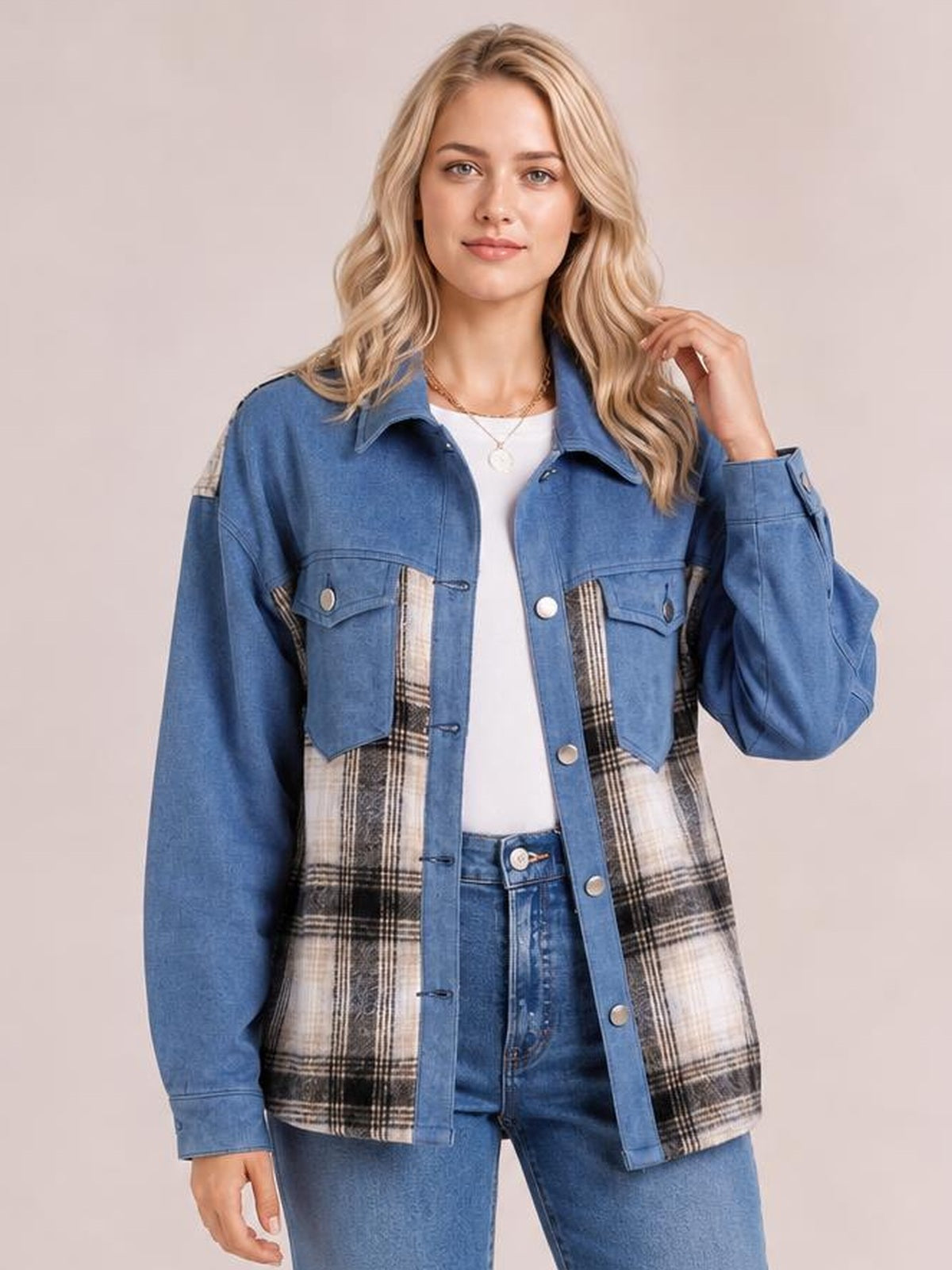 Model wearing a blue plaid button-up long-sleeve denim jacket with patch pockets, contrasting plaid panels, and a relaxed silhouette.