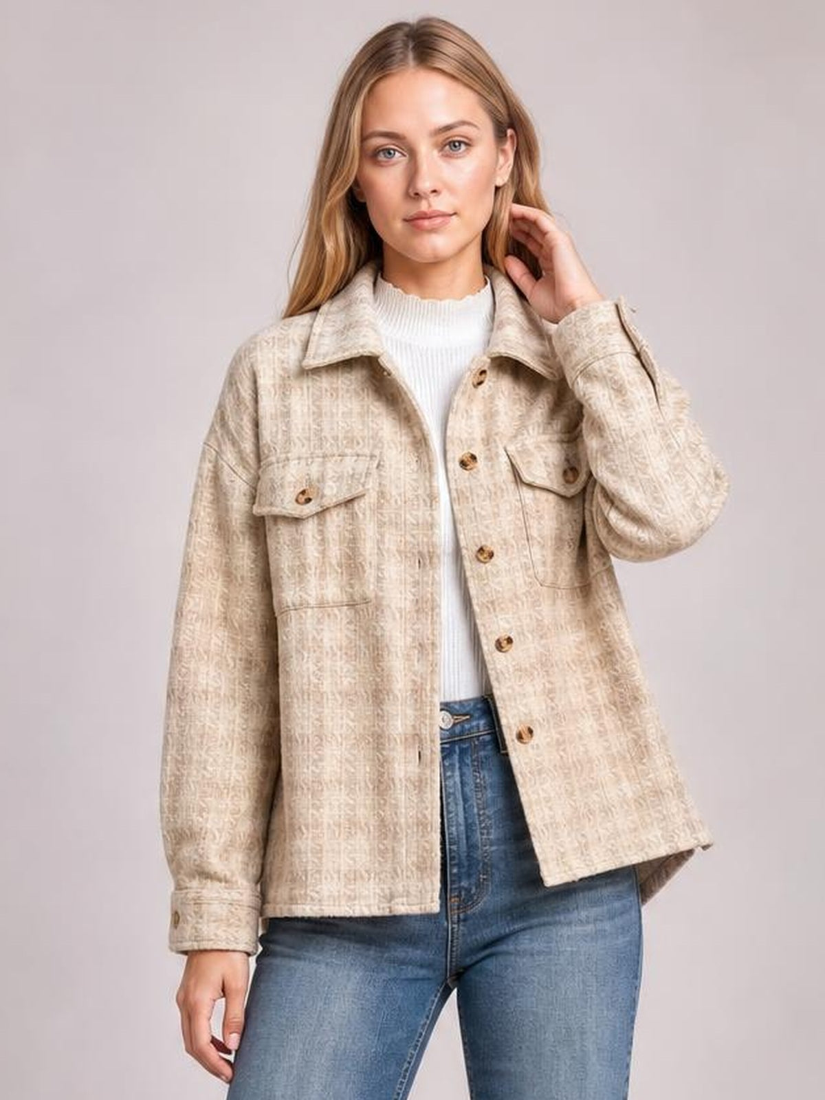 Model wearing a beige plaid button-up jacket with long sleeves, a pointed collar, chest flap pockets, front buttons, and a relaxed straight silhouette.