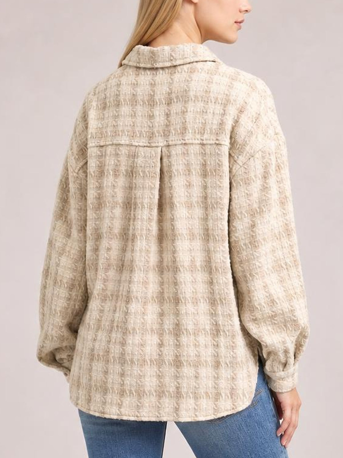 Model shown from the back wearing a light beige plaid long-sleeve jacket with a collar, yoke seam, relaxed silhouette, and gently curved hem.