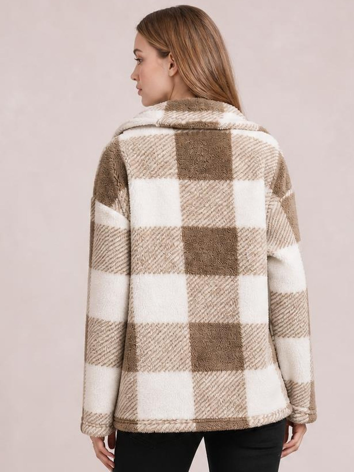 Model shown from the back in a relaxed pose wearing a cream and brown plaid collared button-down jacket with long sleeves and a straight silhouette.