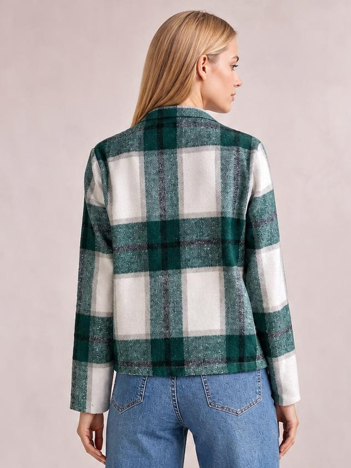 Model shown from behind wearing a green and white plaid long sleeve jacket with a structured, waist-length silhouette and straight hem.