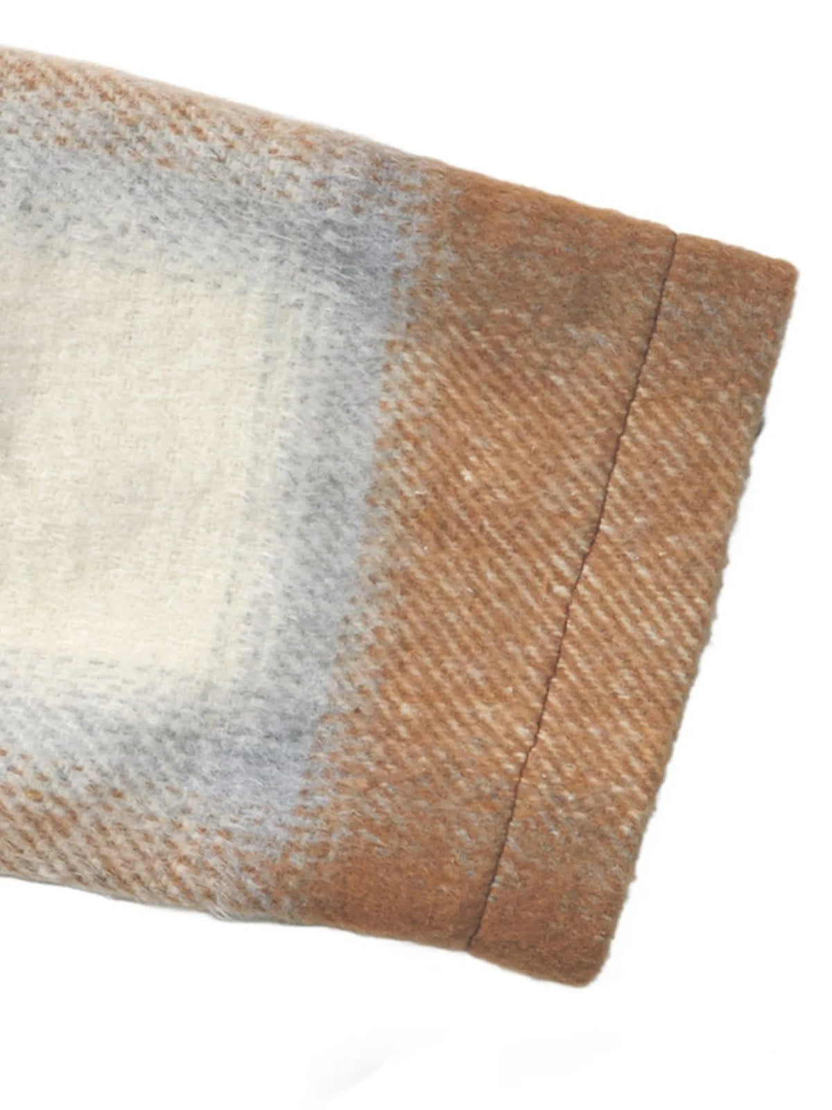 Close-up of a brown and gray plaid wool-blend jacket sleeve, showing its soft textured weave and neatly stitched cuff construction.
