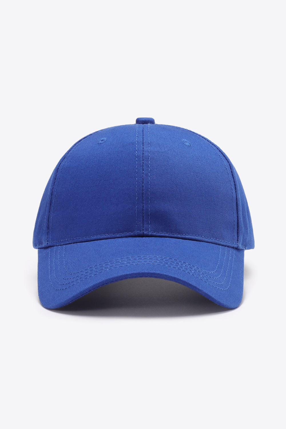 Royal blue cotton baseball cap with a structured six-panel crown, gently curved brim, tonal stitching, top button, and small ventilation eyelets.