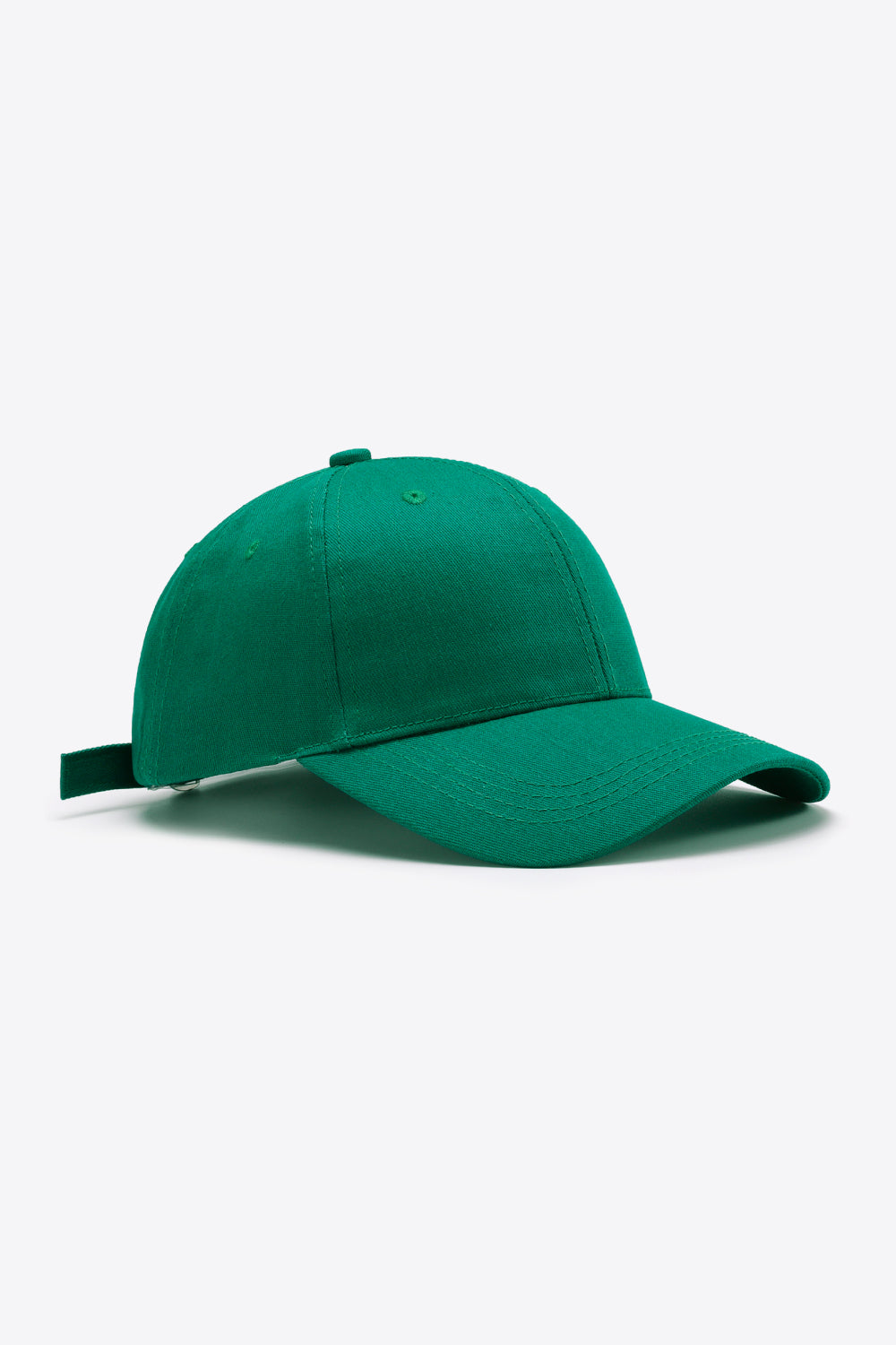 Solid green cotton baseball cap with a structured paneled crown, gently curved brim, tonal stitching, ventilation eyelets, and an adjustable back strap.