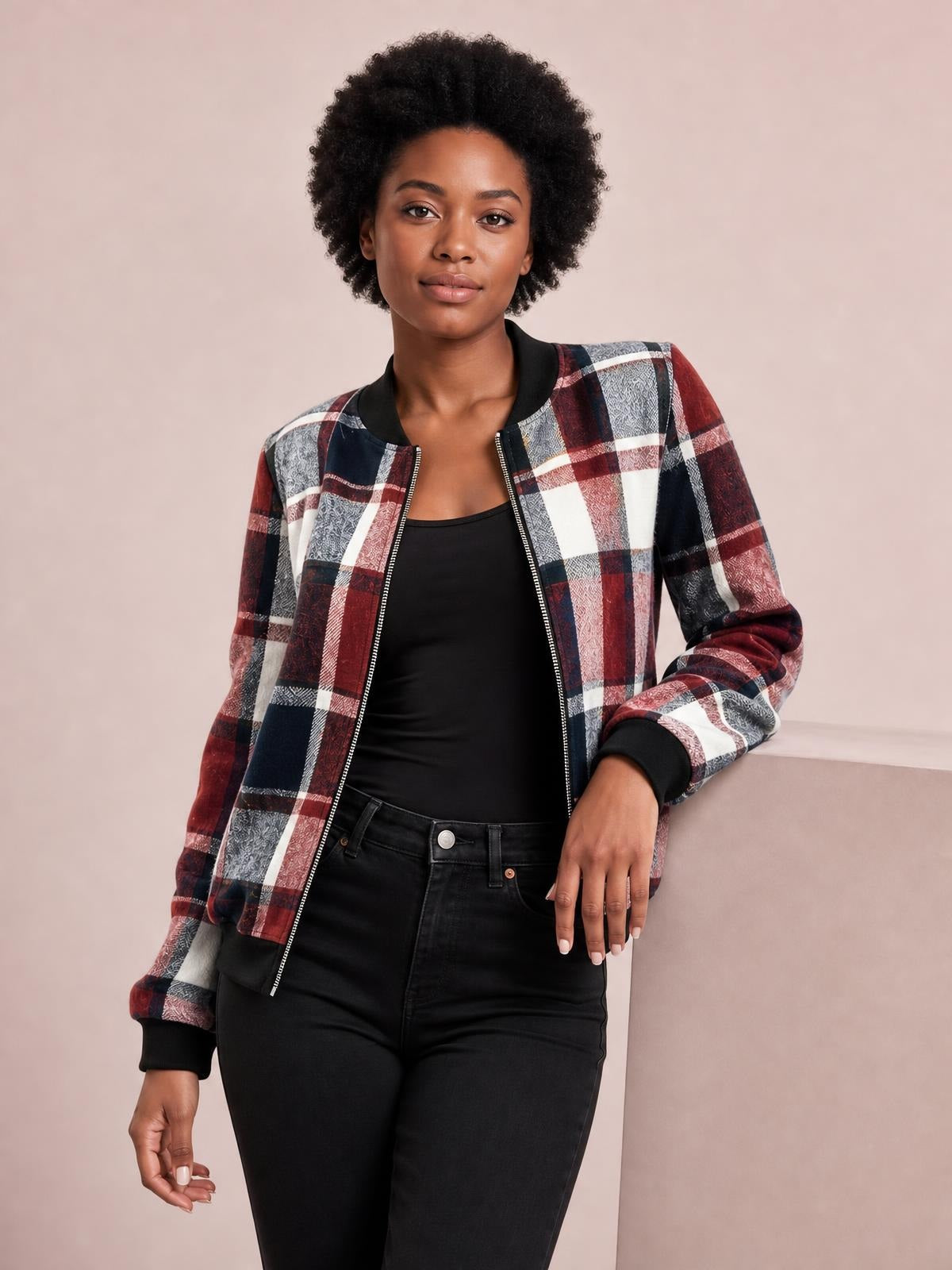 Model wearing an open plaid baseball collar zip-up jacket in burgundy, navy, white, and gray with long sleeves, ribbed cuffs, and a relaxed silhouette.