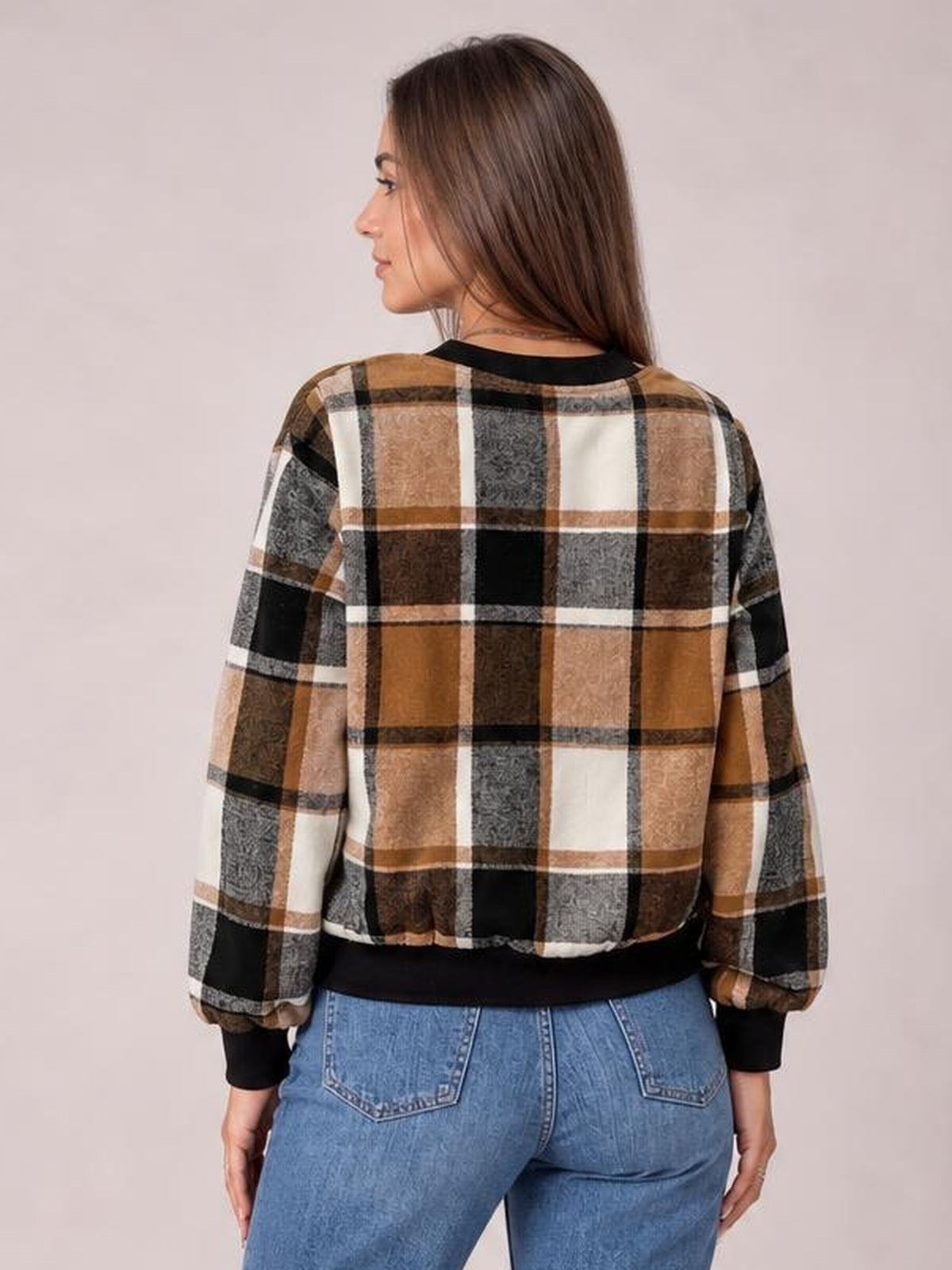 Model shown from the back in a brown, black, gray, and white plaid baseball collar zip-up jacket with a cropped silhouette and ribbed trim.