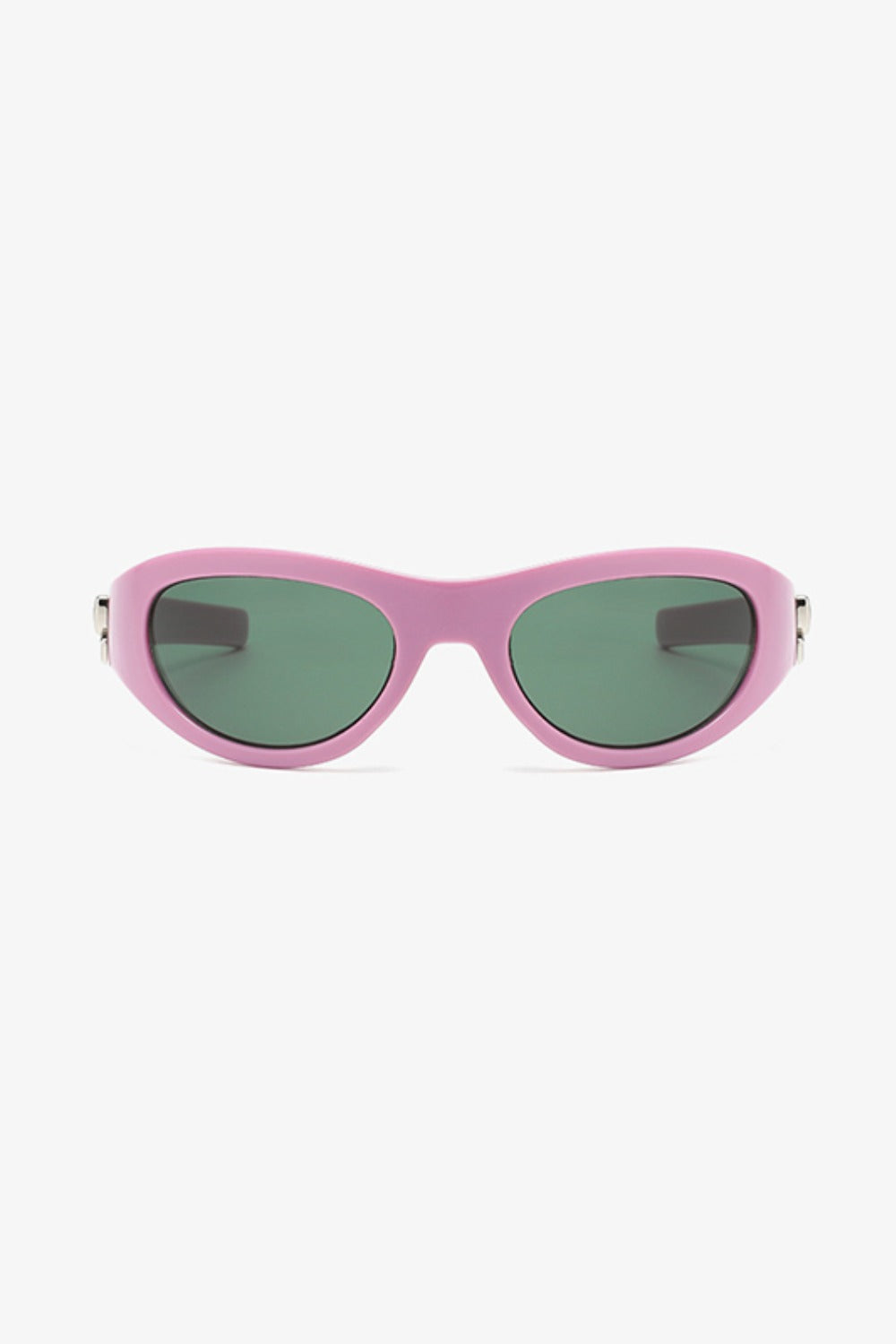 Pink polycarbonate cat-eye sunglasses feature rounded green lenses, softly upswept corners, a streamlined bridge, and subtle silver side detailing.