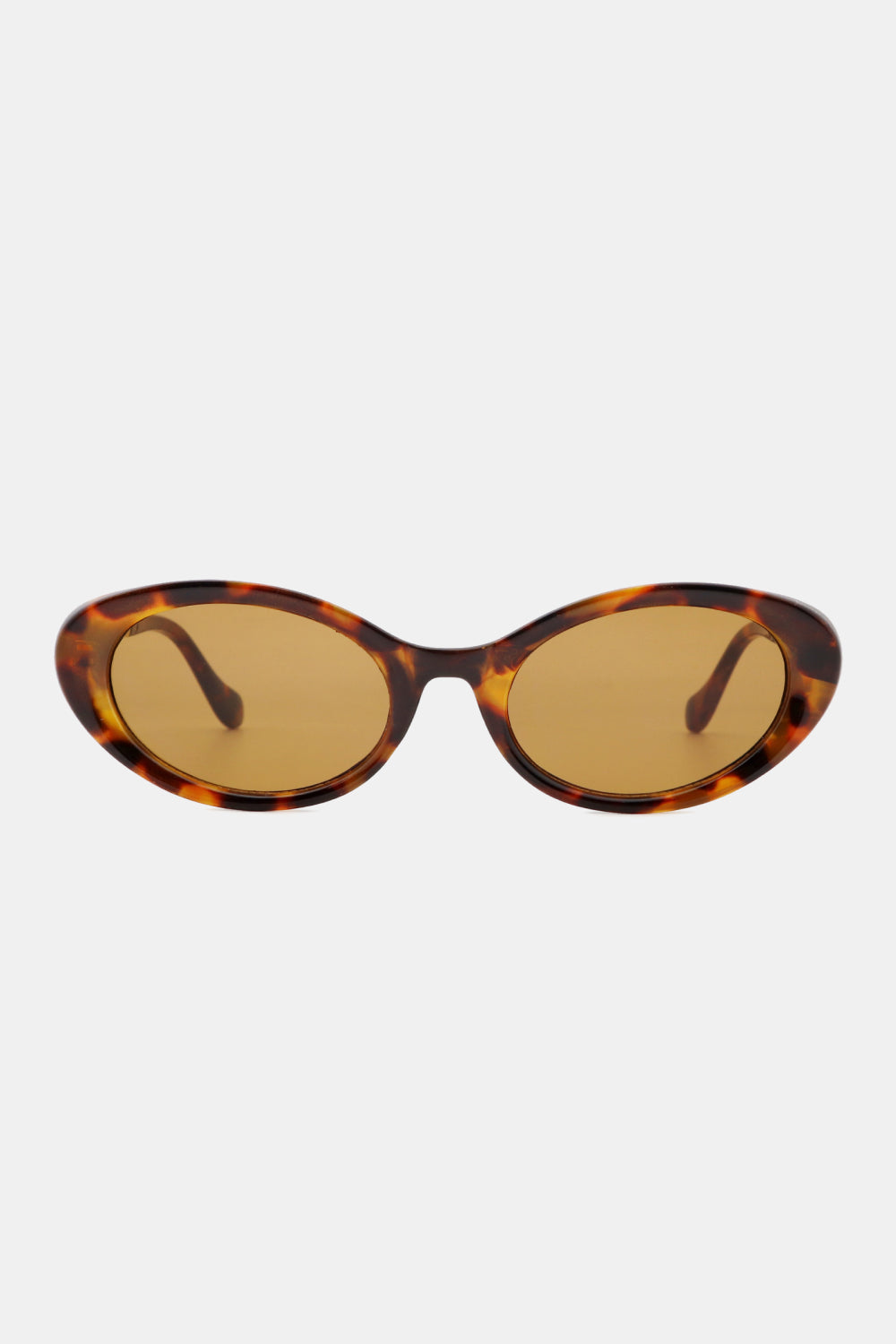 Tortoiseshell polycarbonate cat-eye sunglasses feature rounded amber-tinted lenses, a softly upswept silhouette, and sculpted frames with slim curved temples.