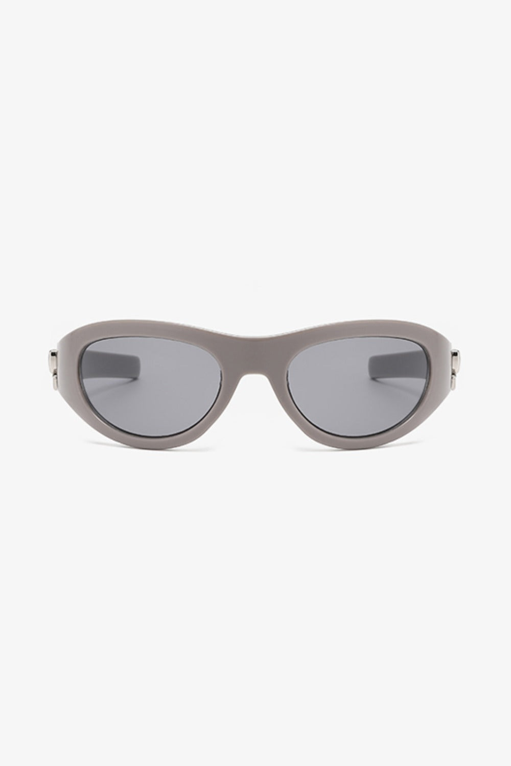 Taupe polycarbonate cat-eye sunglasses feature rounded gray lenses, softly upswept outer corners, a streamlined bridge, tapered temples, and subtle side detailing.