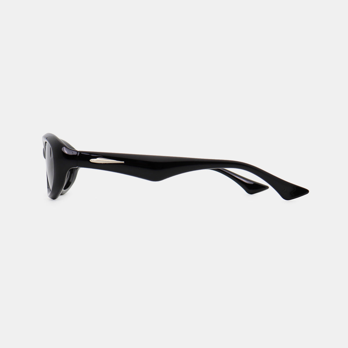 Black polycarbonate cat-eye sunglasses shown in side profile, featuring softly sculpted oval lenses, a smooth frame, shaped bridge, and tapered temples.