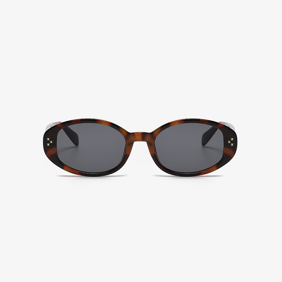 Brown tortoiseshell-inspired polycarbonate oval sunglasses feature softly rounded frames, dark lenses, and small star-like accents at the outer corners.