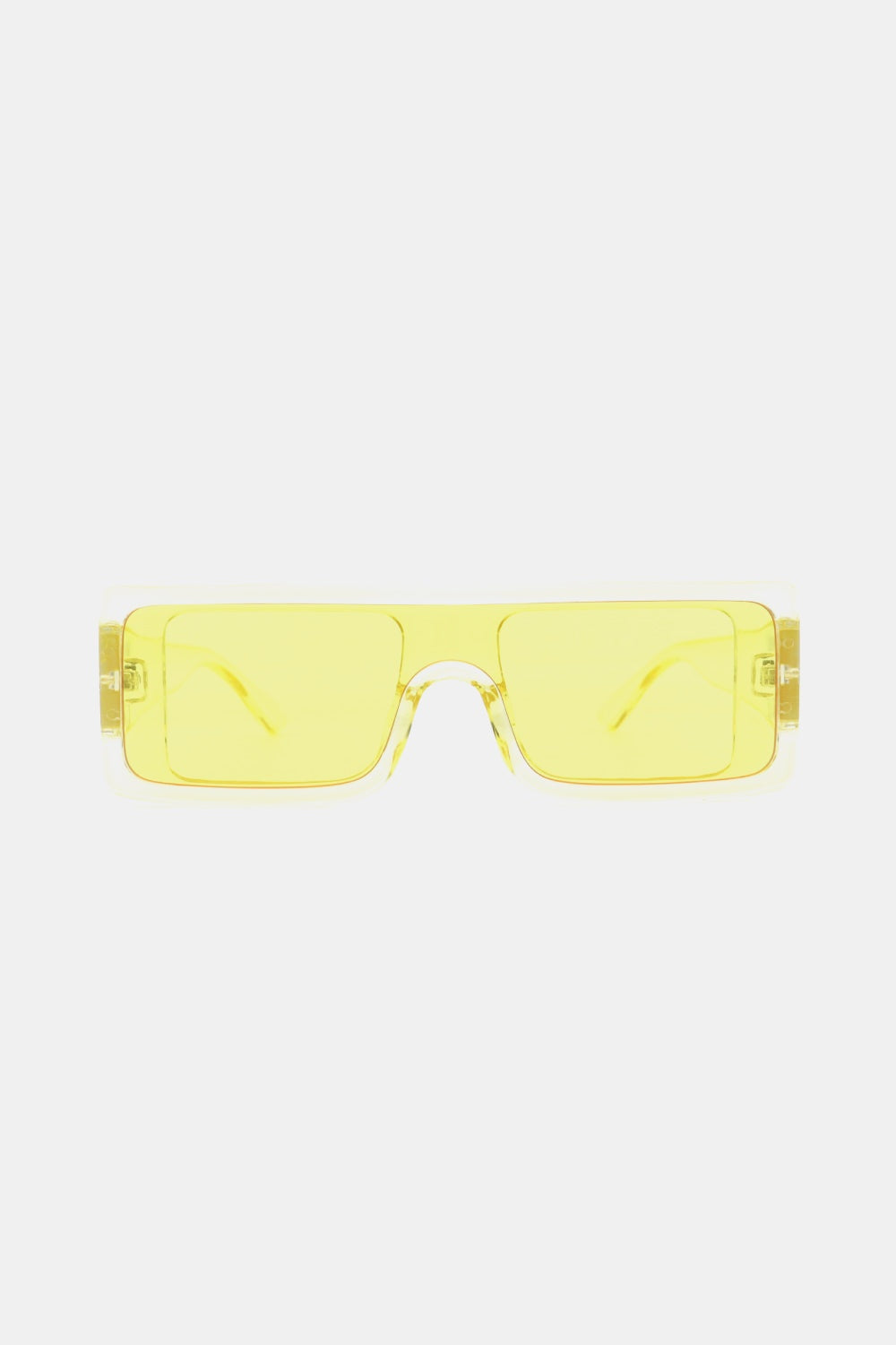 Translucent yellow polycarbonate rectangle sunglasses feature a broad, squared front, matching lenses, and a sleek structured frame with folded temples.