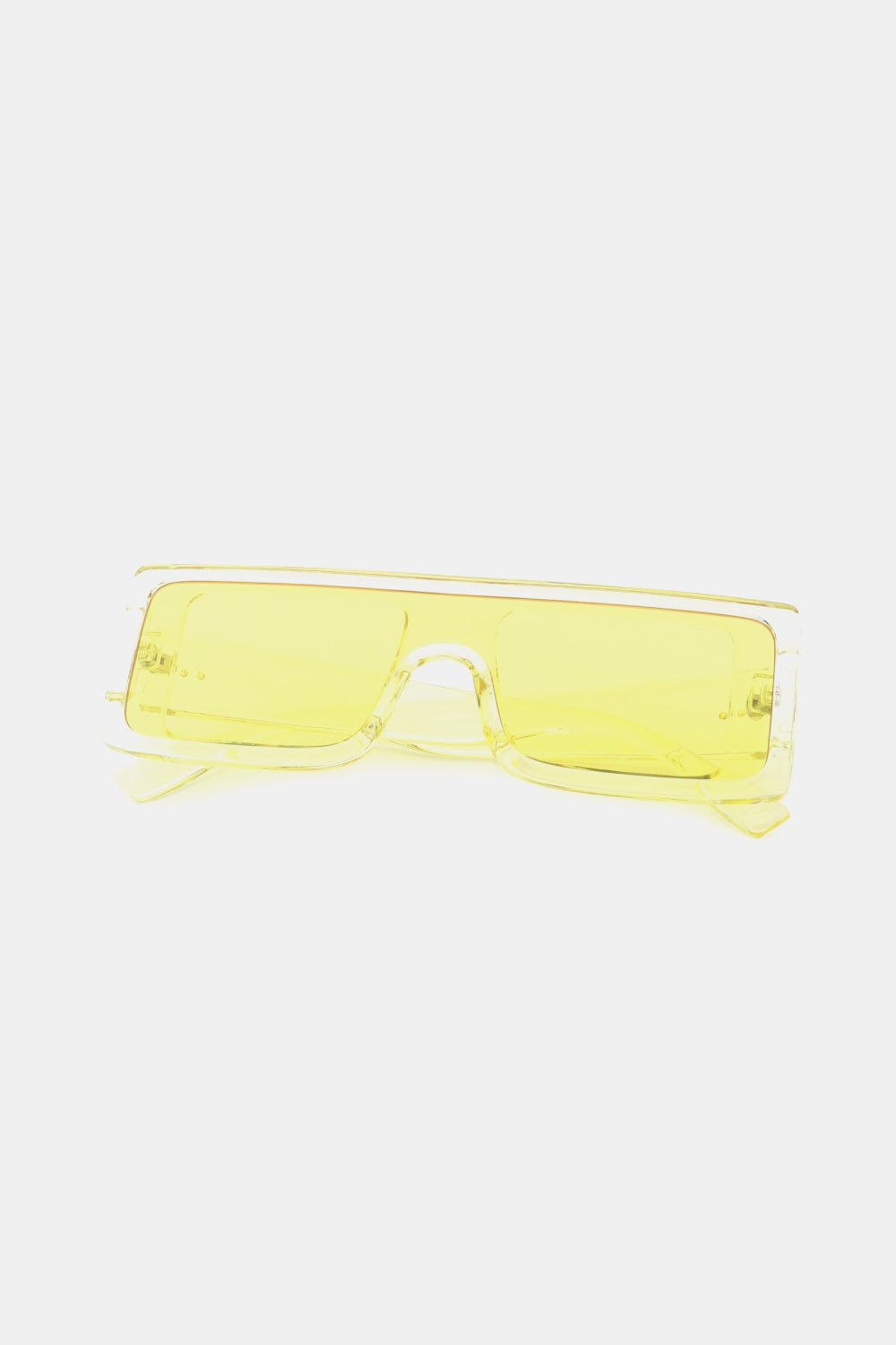 Translucent yellow polycarbonate rectangle sunglasses feature a broad front, squared lenses, and a structured frame with matching temples.