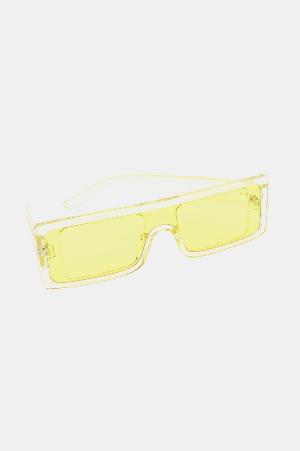 Transparent yellow polycarbonate rectangle sunglasses feature a broad squared front, matching lenses, streamlined temples, and a bold modern silhouette.