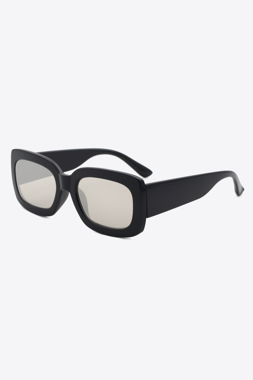 Black polycarbonate rectangle sunglasses feature a bold oversized-inspired frame, softly rounded corners, wide temples, and lightly tinted lenses.