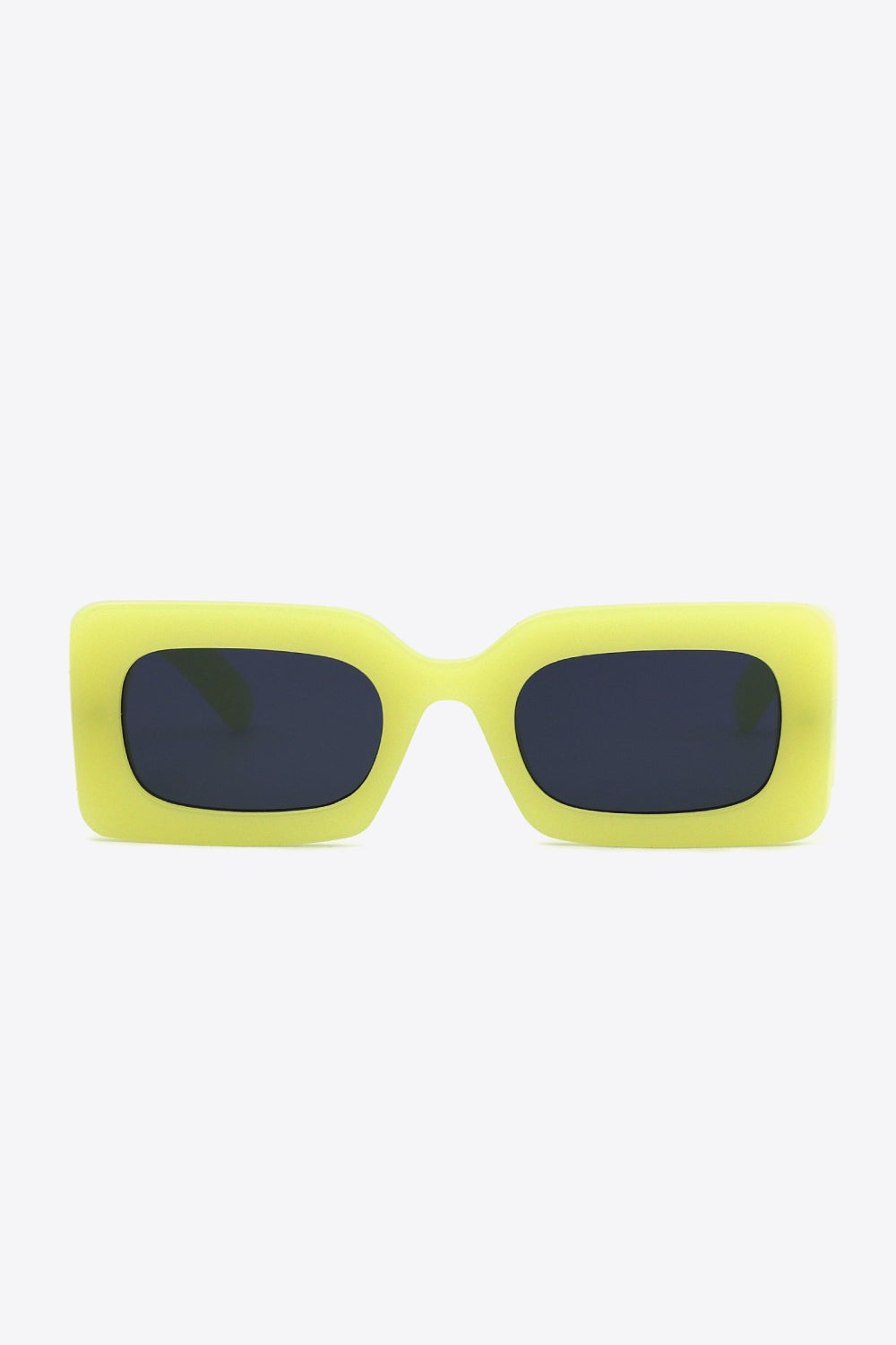 Bold neon yellow polycarbonate rectangle sunglasses feature softly rounded dark lenses and a substantial sculptural frame with a polished modern silhouette.