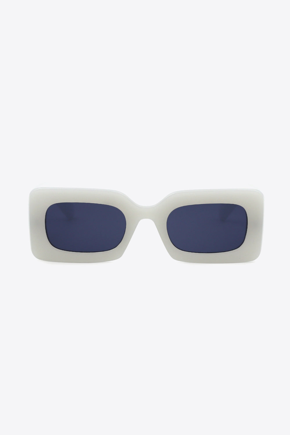 Off-white polycarbonate rectangle sunglasses feature a bold, softly rounded frame, dark blue lenses, and substantial sculptural temples for a modern silhouette.