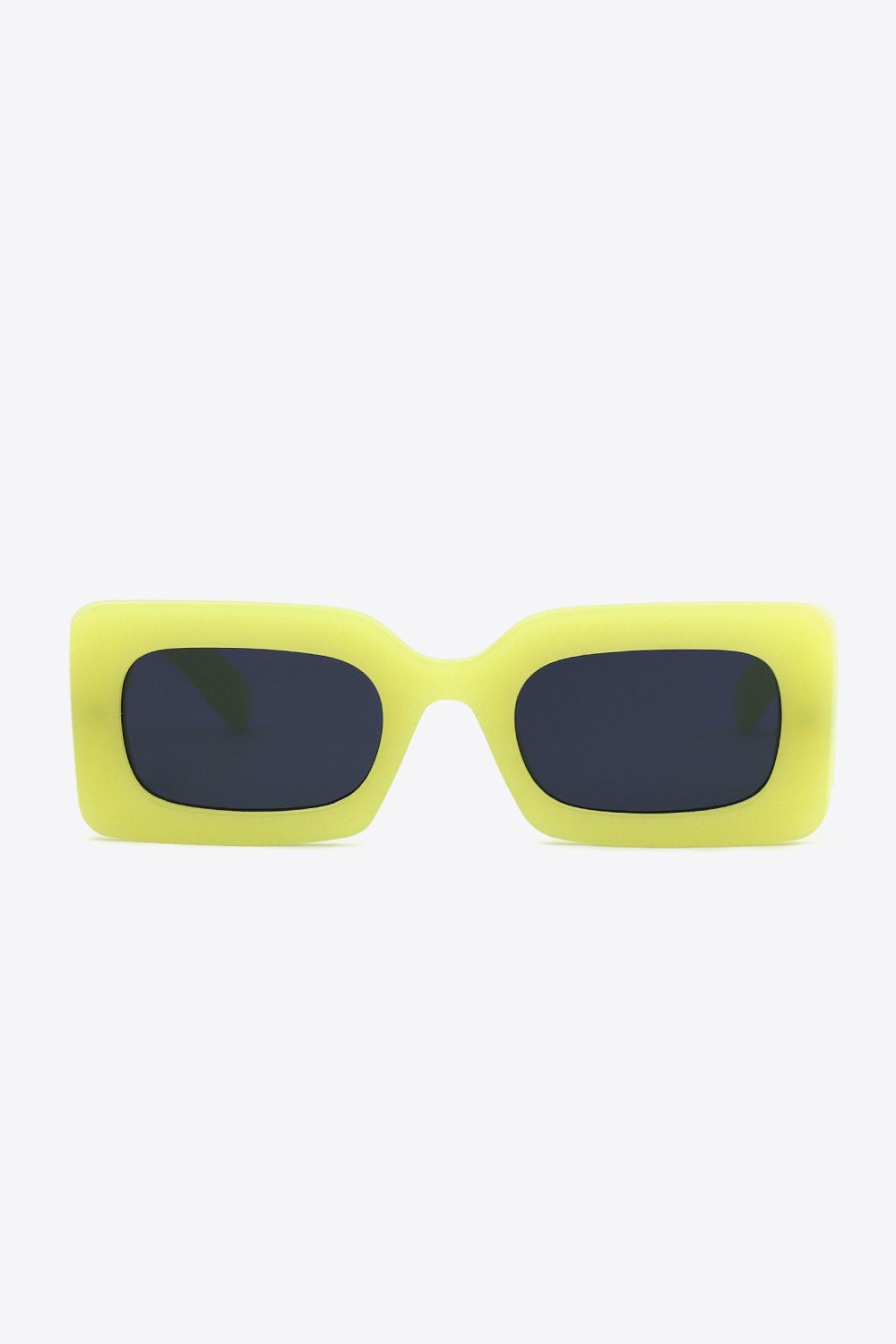 Bold neon yellow polycarbonate rectangle sunglasses feature softly rounded dark lenses and a substantial sculptural frame with a polished modern silhouette.