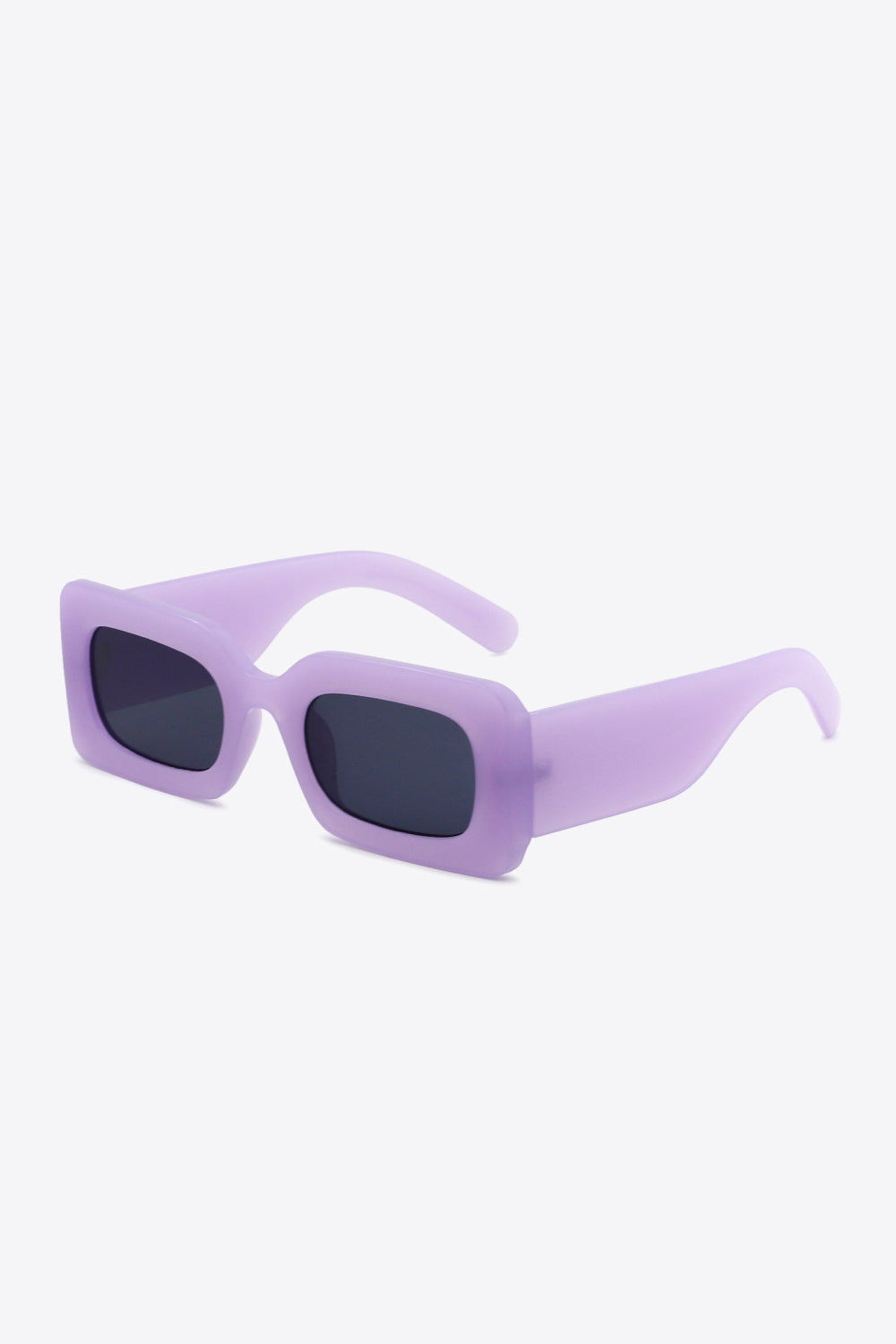 Lavender polycarbonate rectangle sunglasses feature softly rounded dark lenses, a bold sculptural frame, and substantial tapered temples for a modern silhouette.