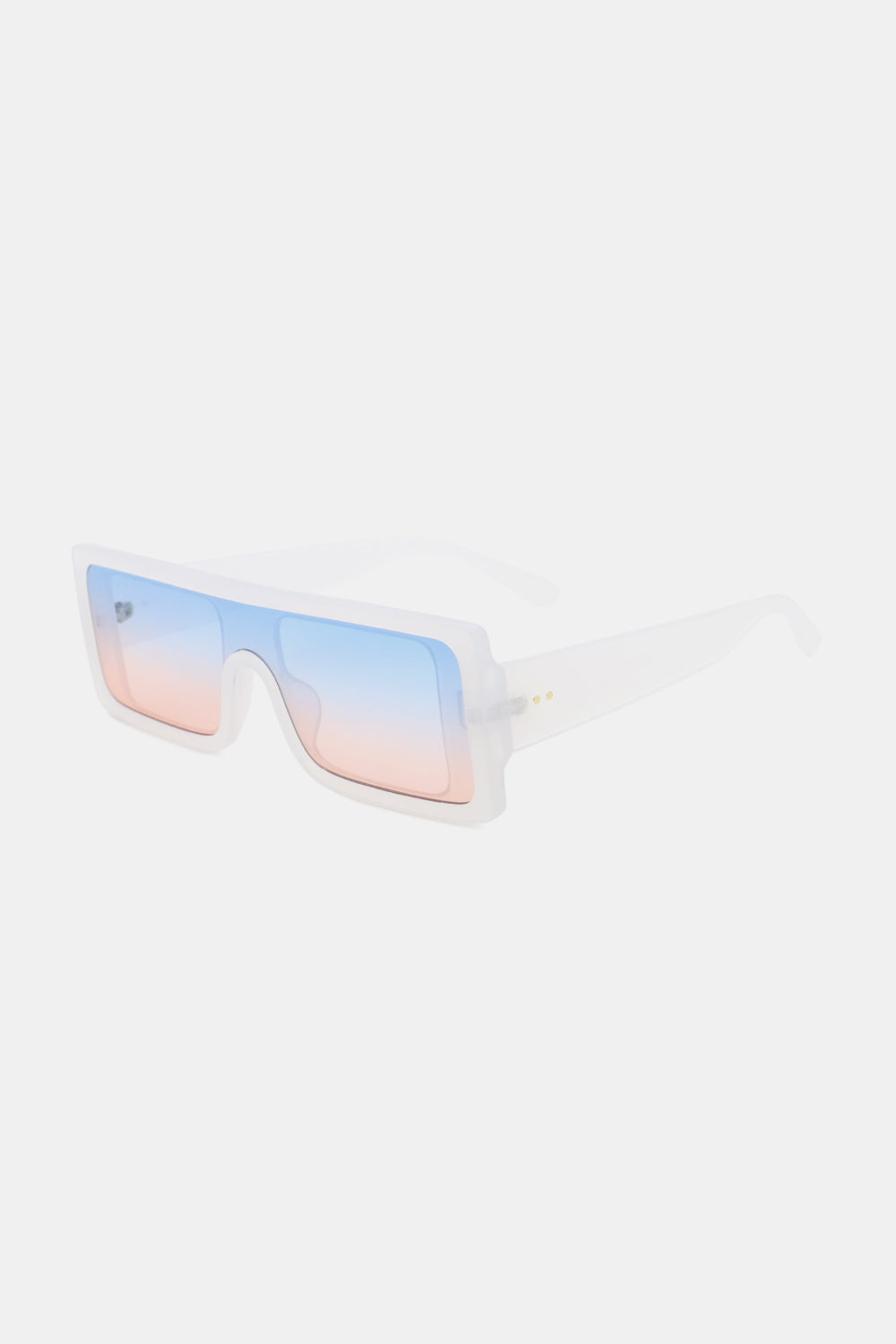 Translucent white polycarbonate rectangle sunglasses feature a broad squared frame and oversized blue-to-pink gradient lenses in a sleek angled view.