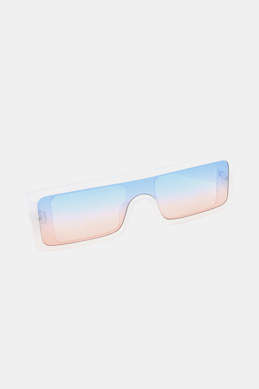 Transparent polycarbonate rectangle sunglasses feature a broad, squared frame and blue-to-pink gradient lenses for a modern statement silhouette.