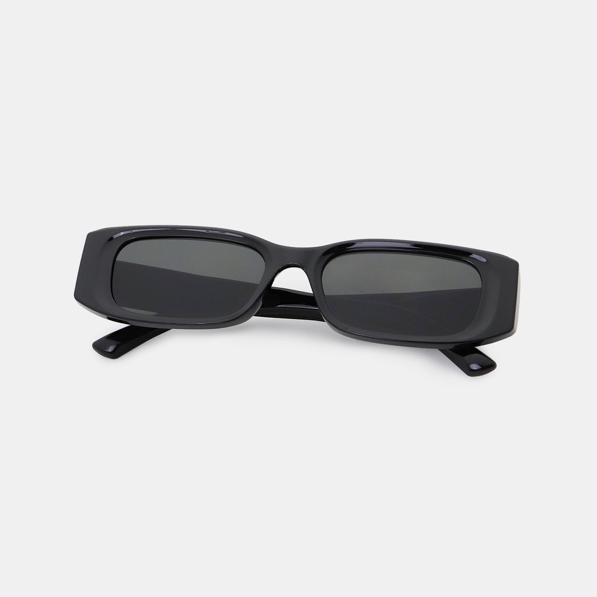 Glossy black polycarbonate rectangle sunglasses feature broad squared frames, softly rounded corners, dark lenses, and wide temples in a streamlined modern silhouette.
