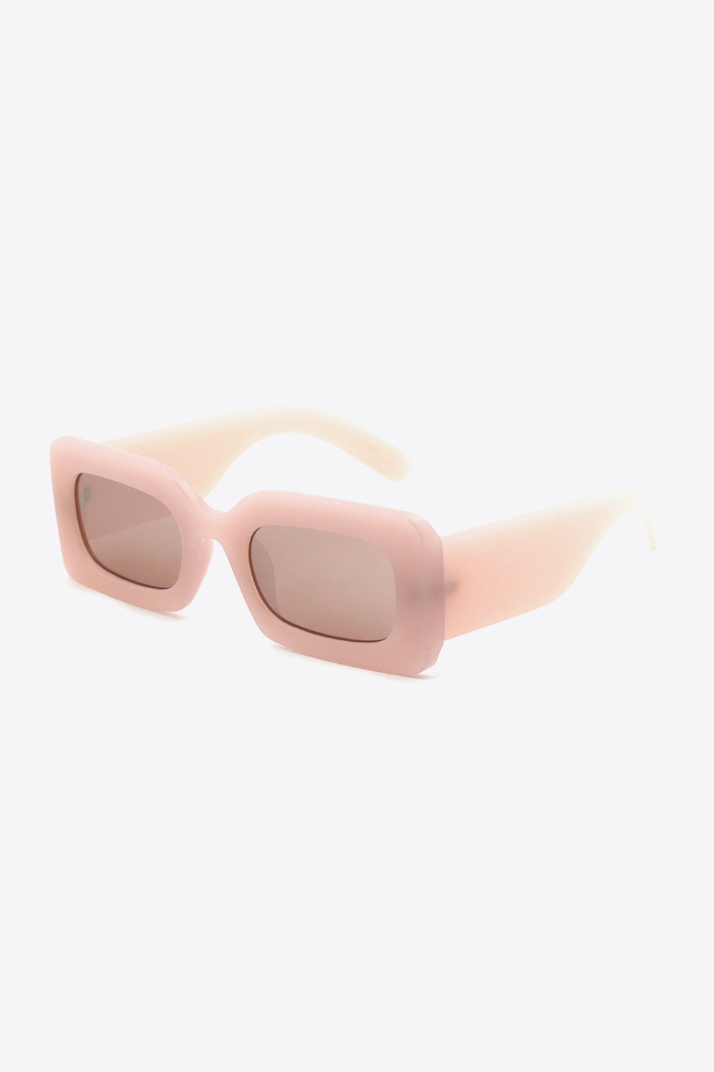 Pink polycarbonate rectangle sunglasses feature softly rounded lenses, a bold thick frame, and wide sculptural temples in a polished modern silhouette.
