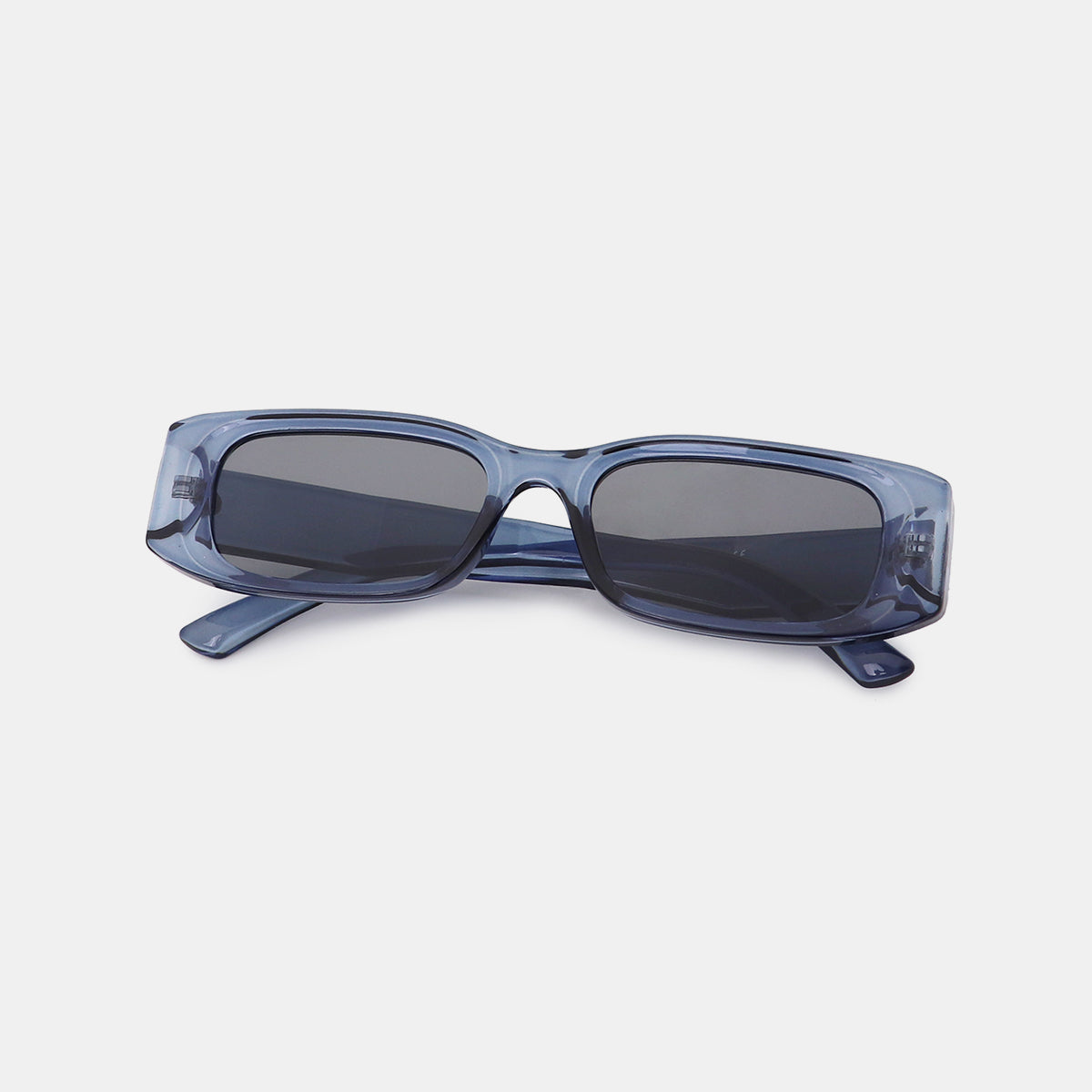Translucent blue-gray polycarbonate rectangle sunglasses feature broad squared frames, softly rounded corners, dark lenses, and wide temples for a sleek modern silhouette.